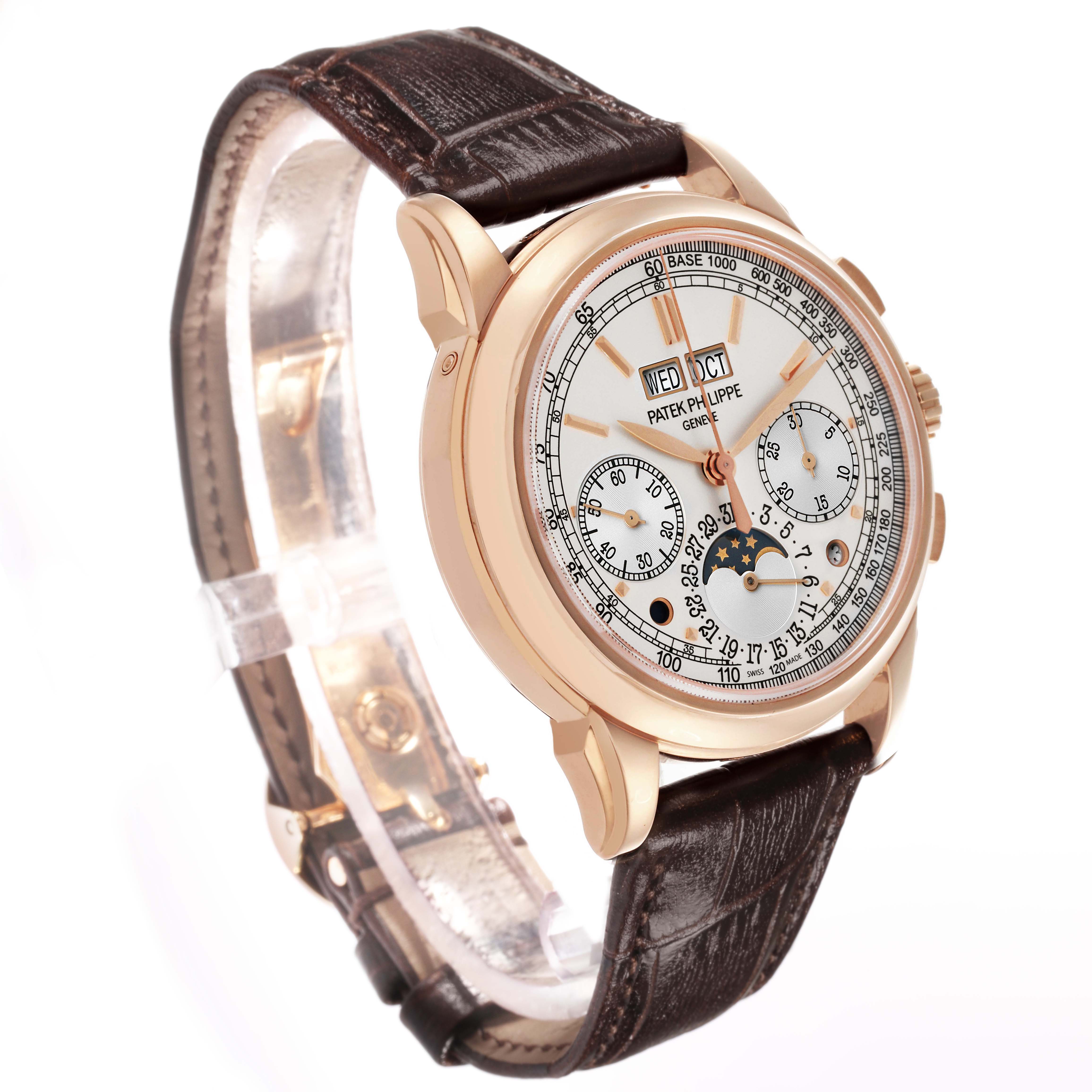 The Patek Philippe Complications 5270R-001 Men's Rose Gold Silver Dial watch is shown at a slight angle, displaying its face, detailing, and leather strap.