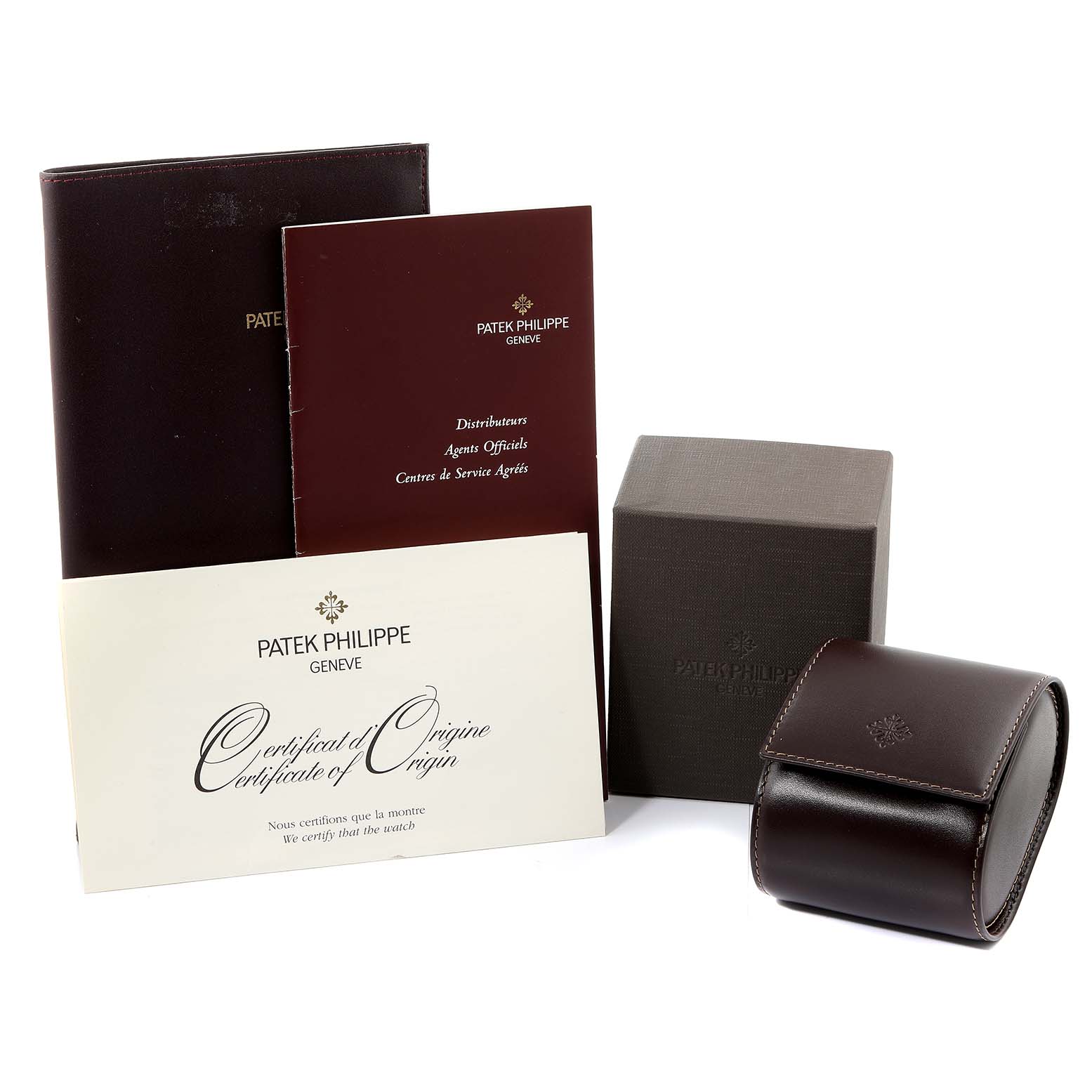 This image shows the packaging and documentation accessories for the Patek Philippe Twenty-4 4910/11R Women
s Rose Gold Black Dial 4910/11R Women
s Rose Gold Black Dial model watch.