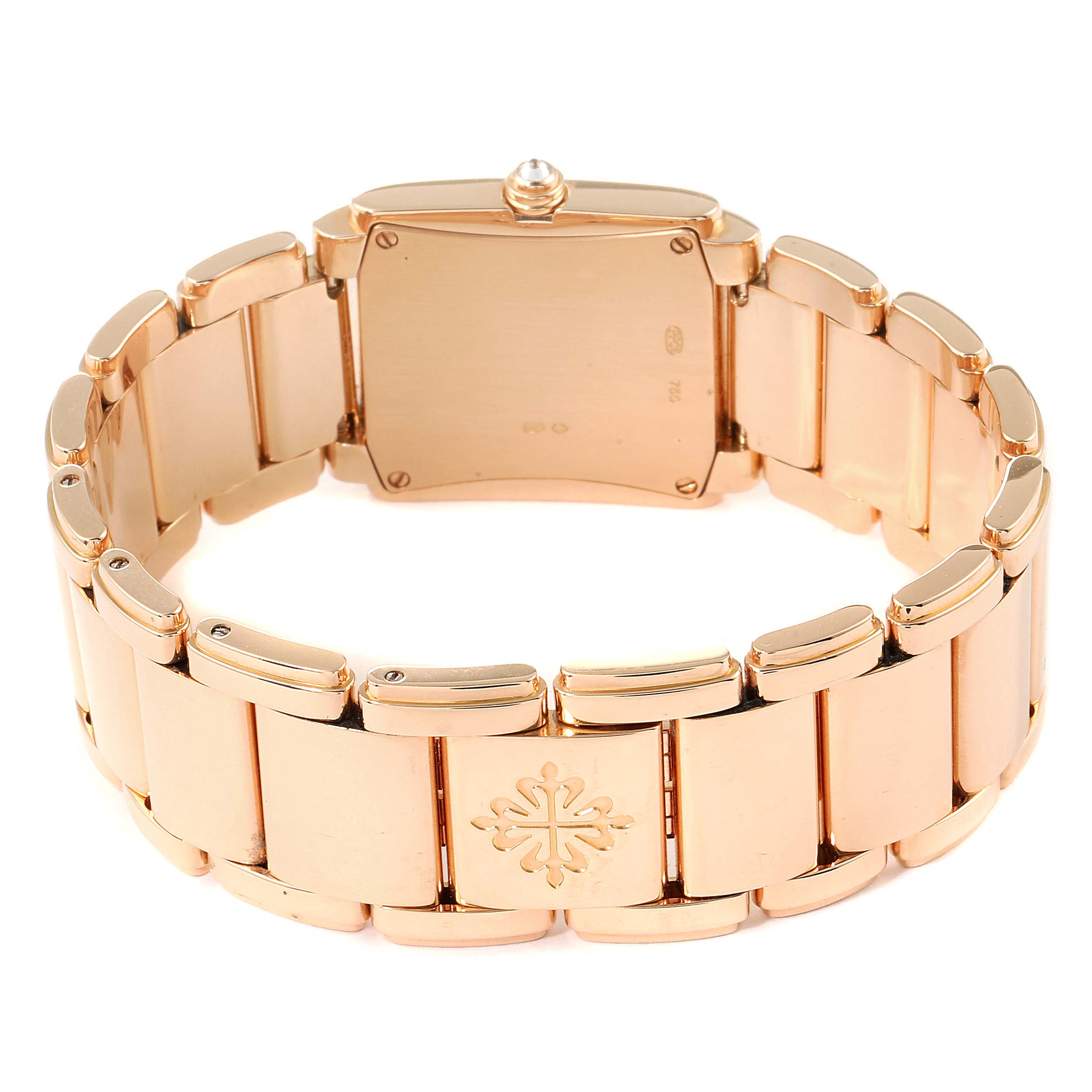 The image shows the back view of a Patek Philippe Twenty-4 4910/11R Women
s Rose Gold Black Dial 4910/11R Women
s Rose Gold Black Dial watch, featuring its bracelet and caseback.