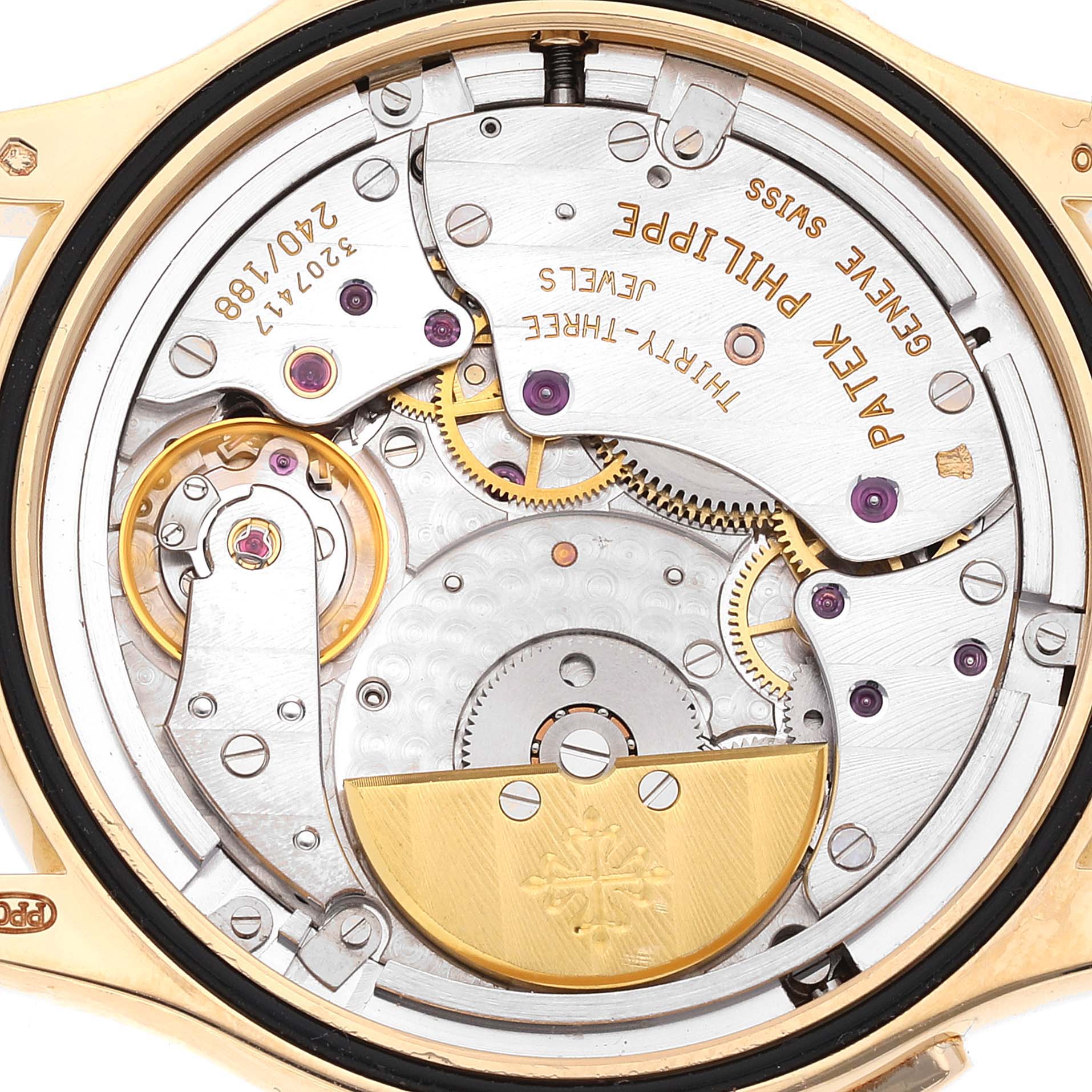 A close-up view of the back of a Patek Philippe Complications 5110 Men's Yellow Gold Silver Dial 5110 Men's Yellow Gold Silver Dial model, showing the intricate movement and internal mechanisms.