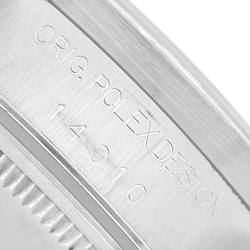 The image shows a close-up of the side engraving on a Rolex Air-King 14010 Men's Stainless Steel Blue Dial watch, featuring "ORIG. ROLEX DESIGN" and model number.