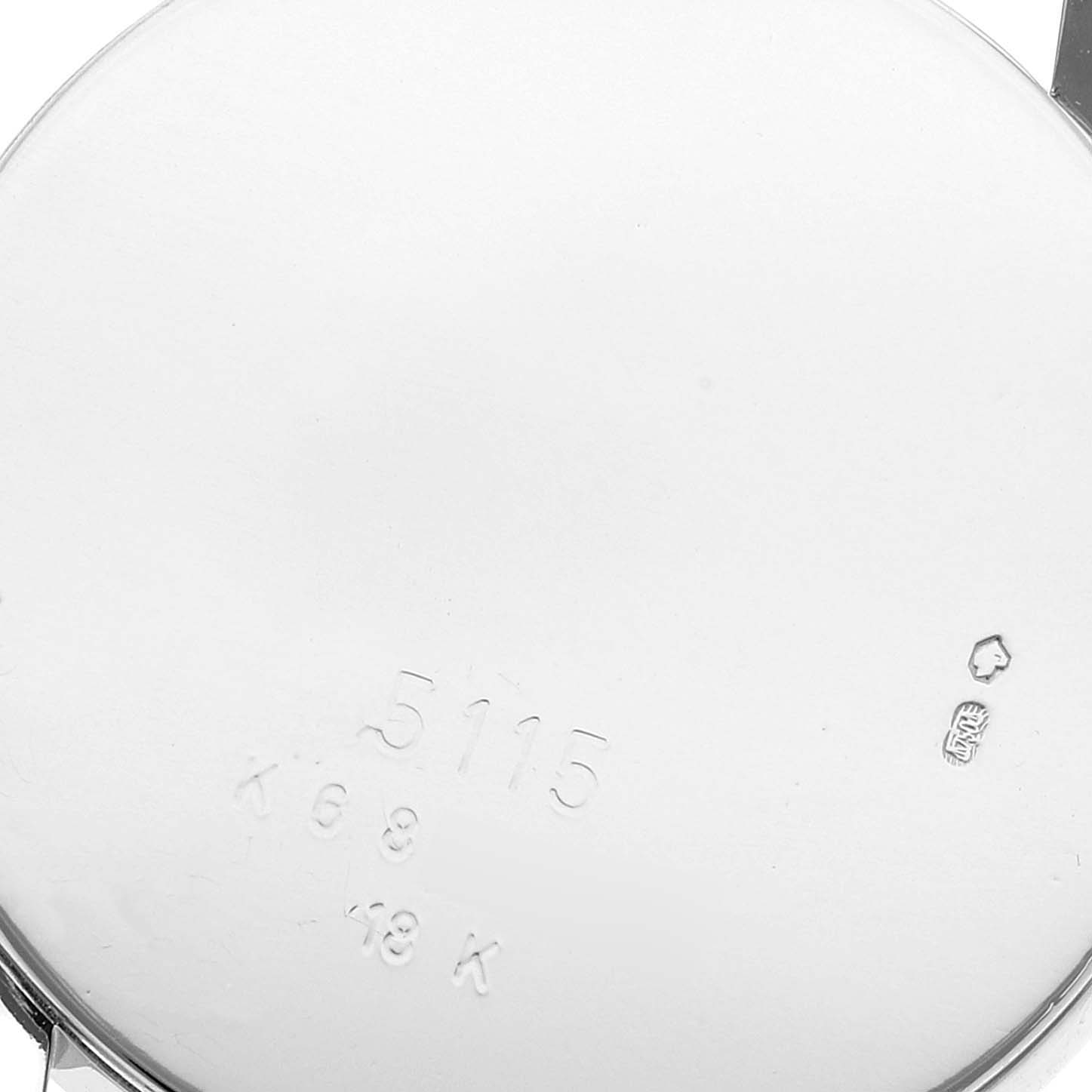 This image shows the back of a Rolex Cellini 5115 Men
s White Gold Black Dial 5115 Men
s White Gold Black Dial watch, displaying the model number and hallmark engravings.