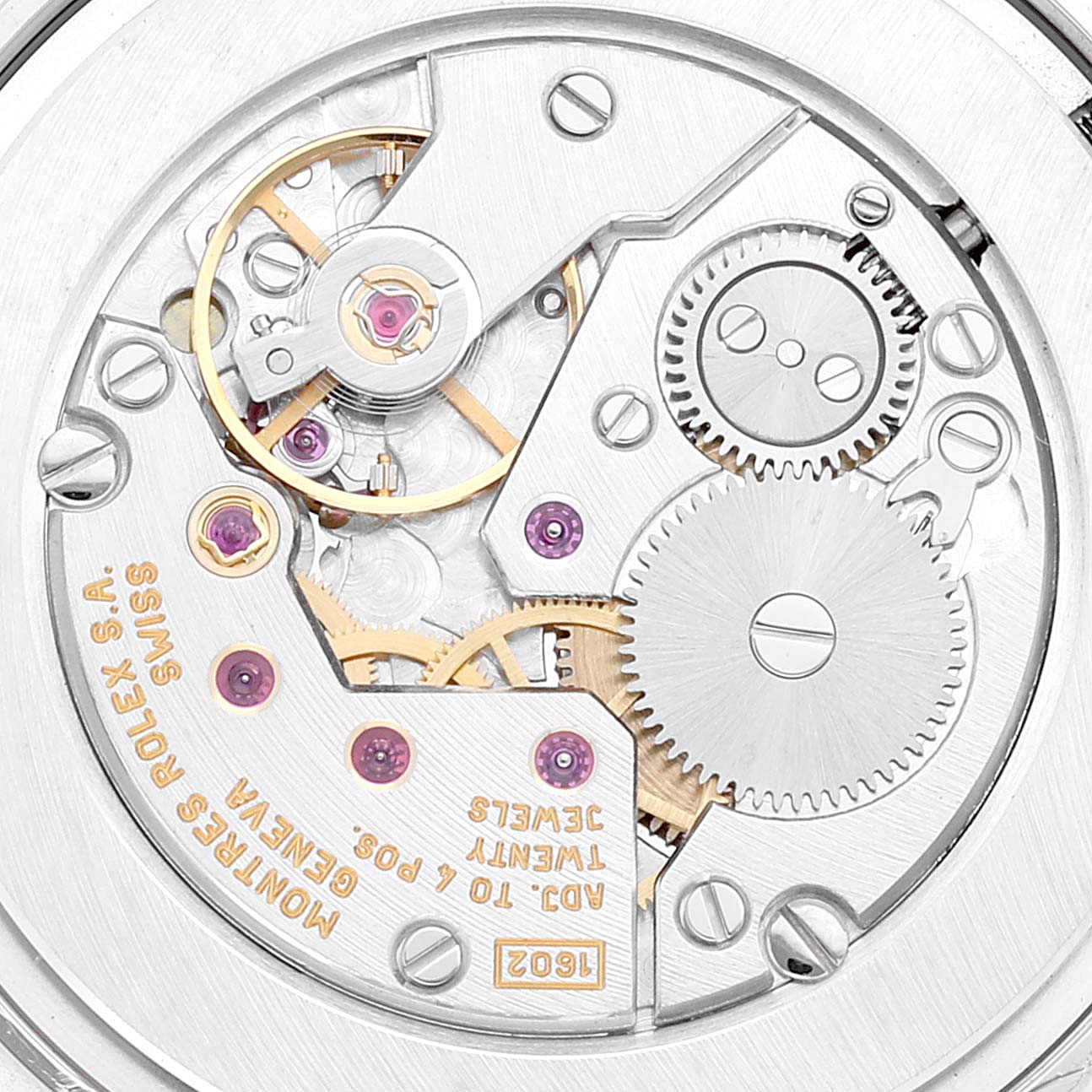 This image shows an angled close-up of the Rolex Cellini 5115 Men
s White Gold Black Dial 5115 Men
s White Gold Black Dial watch
s movement, highlighting gears, jewels, and engravings.