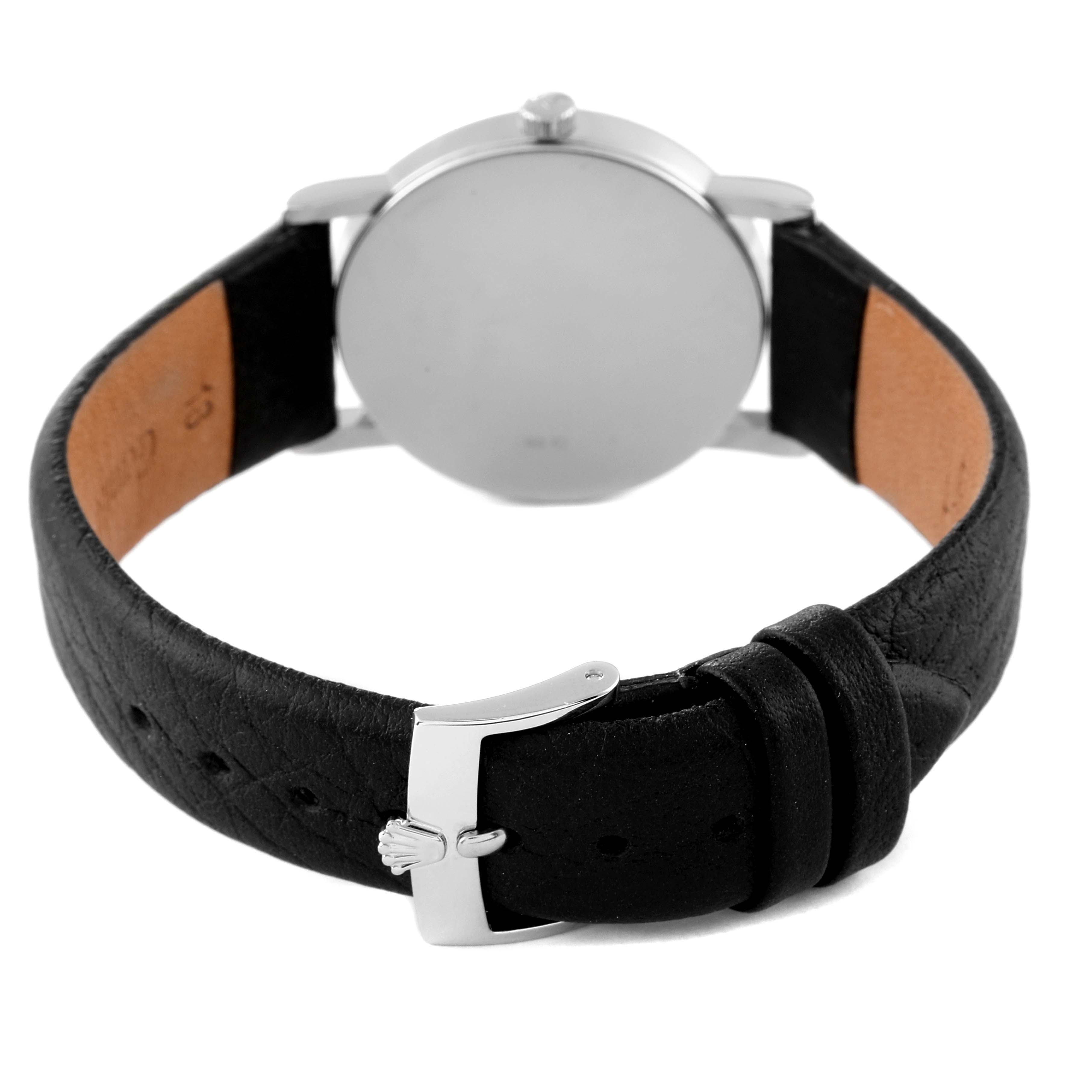 The image shows the back view of the Rolex Cellini 5115 Men
s White Gold Black Dial 5115 Men
s White Gold Black Dial watch, highlighting the leather strap and clasp.