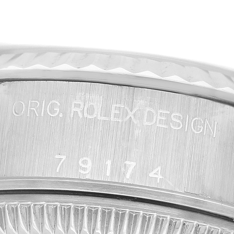 The image shows a close-up of the case side of a Rolex Datejust 79174 Women's Stainless Steel White Dial, highlighting the model number engraving.