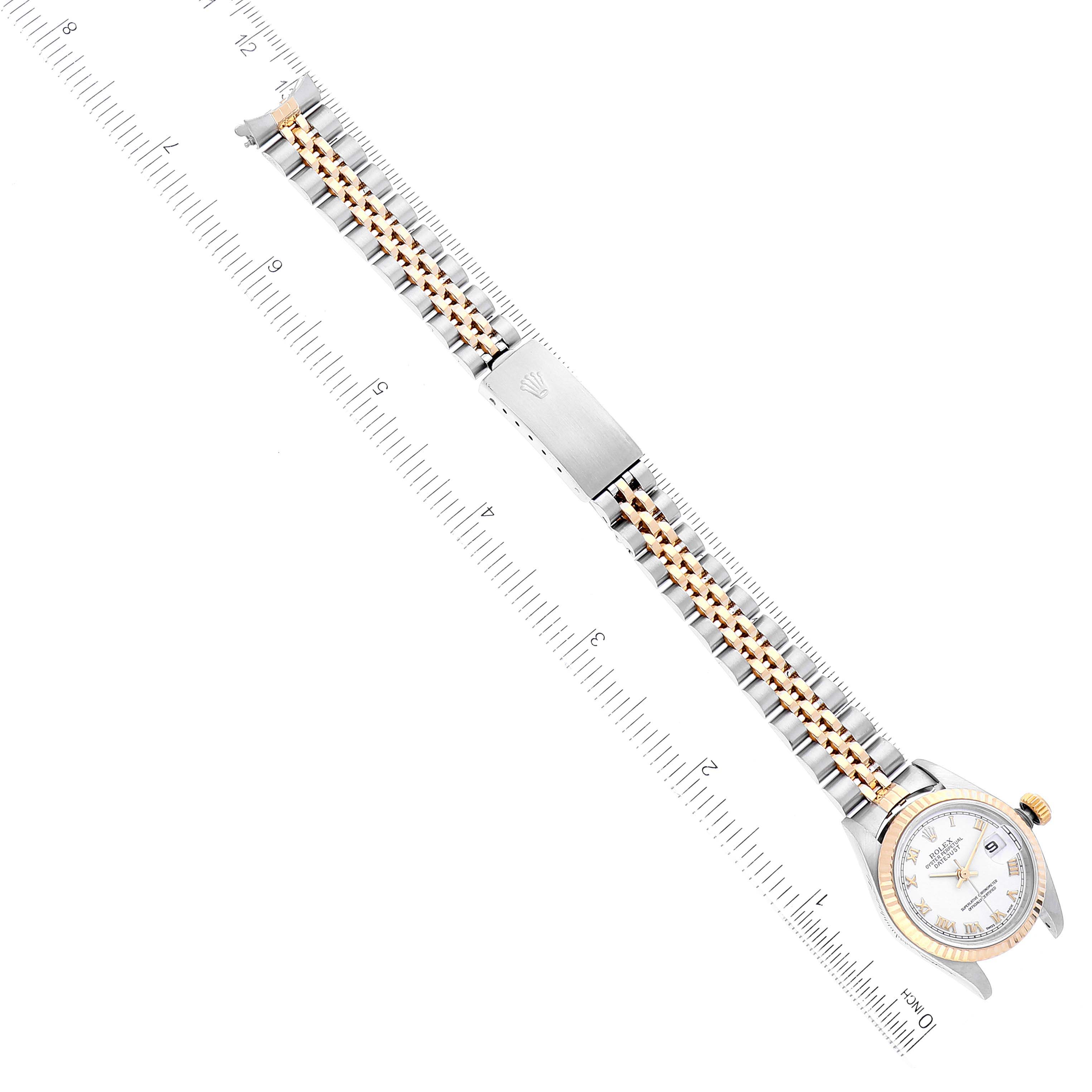 The image shows a Rolex Datejust 79173 Women's Steel and Gold (two tone) White Dial 79173 Women's Steel and Gold (two tone) White Dial watch laid flat, displaying its full bracelet and face from a top-down angle with rulers on each side.