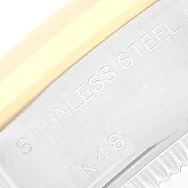 This image shows a close-up of the side of a Rolex Datejust 79173 Women's Steel and Gold (two tone) White Dial 79173 Women's Steel and Gold (two tone) White Dial, highlighting the "Stainless Steel" engraving.