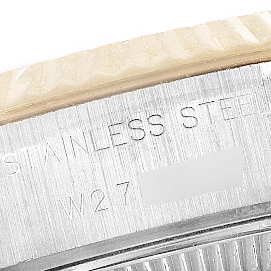 The image shows a close-up of the side of the stainless steel case of a Rolex Datejust 69173 Women's Steel and Gold (two tone) Champagne Dial 69173 Women's Steel and Gold (two tone) Champagne Dial watch.