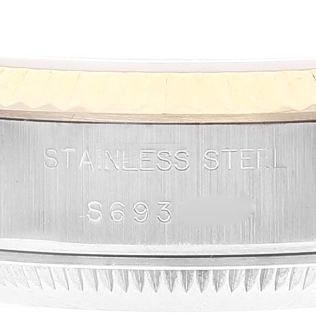 The image shows a close-up of the side of a Rolex Datejust 69173 Women's Steel and Gold (two tone) Champagne Dial 69173 Women's Steel and Gold (two tone) Champagne Dial watch, featuring the "Stainless Steel" engraving.