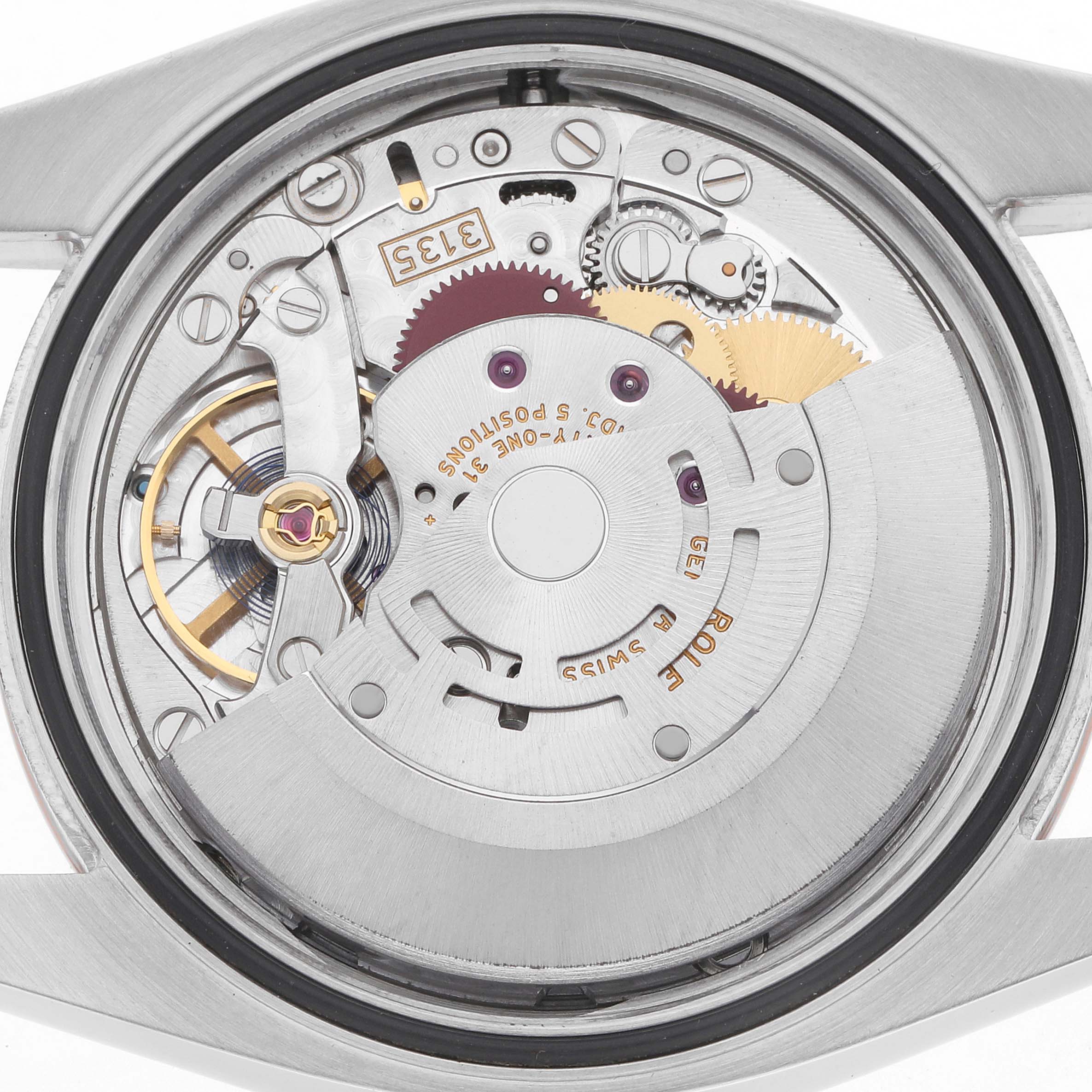 The image shows the movement mechanism of a Rolex Datejust 116231 Men's Steel and Gold (two tone) Silver Dial watch from a rear angle, highlighting its intricate gears and components.