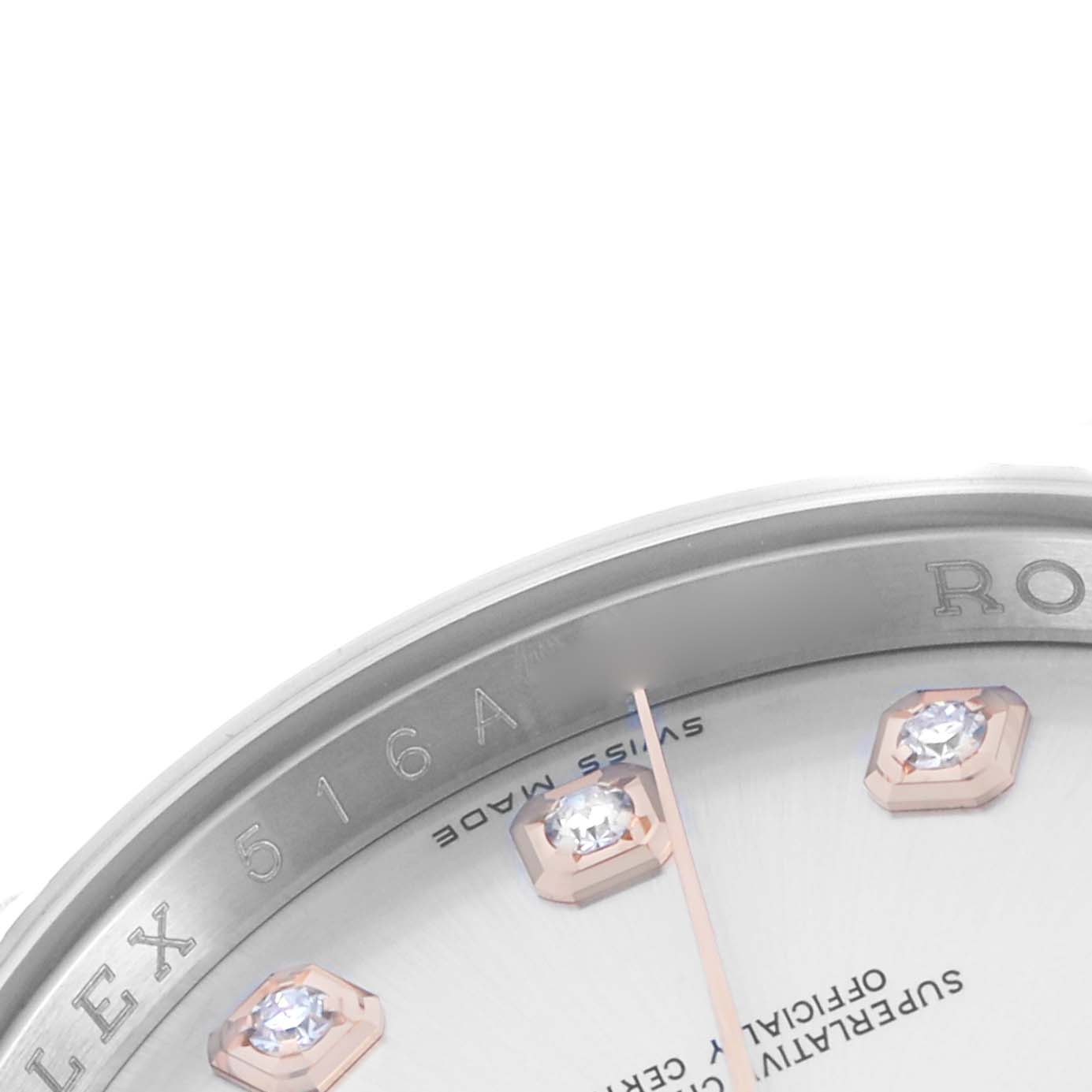 The image shows the Rolex Datejust 116231 Men's Steel and Gold (two tone) Silver Dial watch's partial dial and bezel, featuring jewel markers and engraved text.