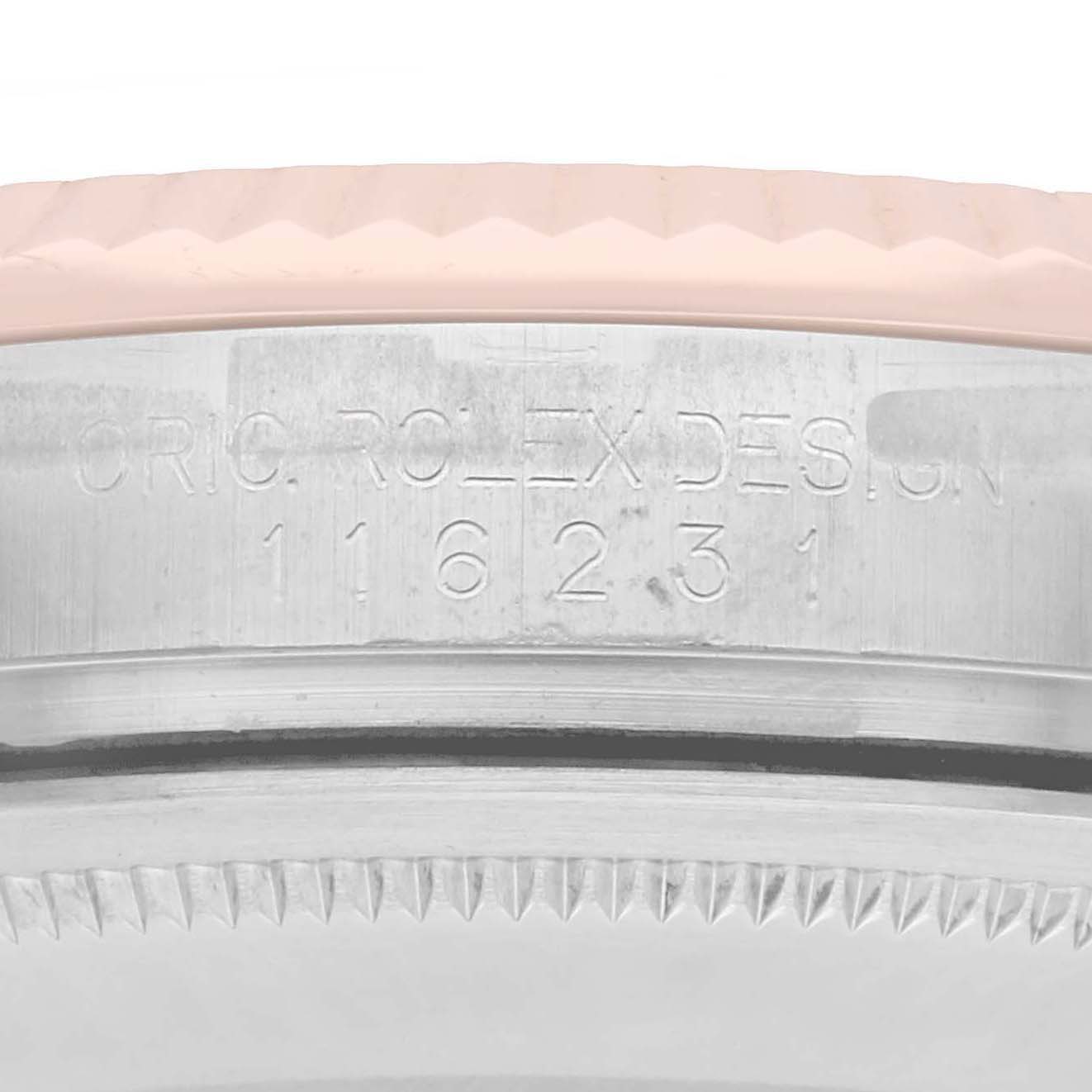 The image shows a close-up of the side of a Rolex Datejust 116231 Men's Steel and Gold (two tone) White Dial watch's case, featuring its model number and Rolex design engraving.