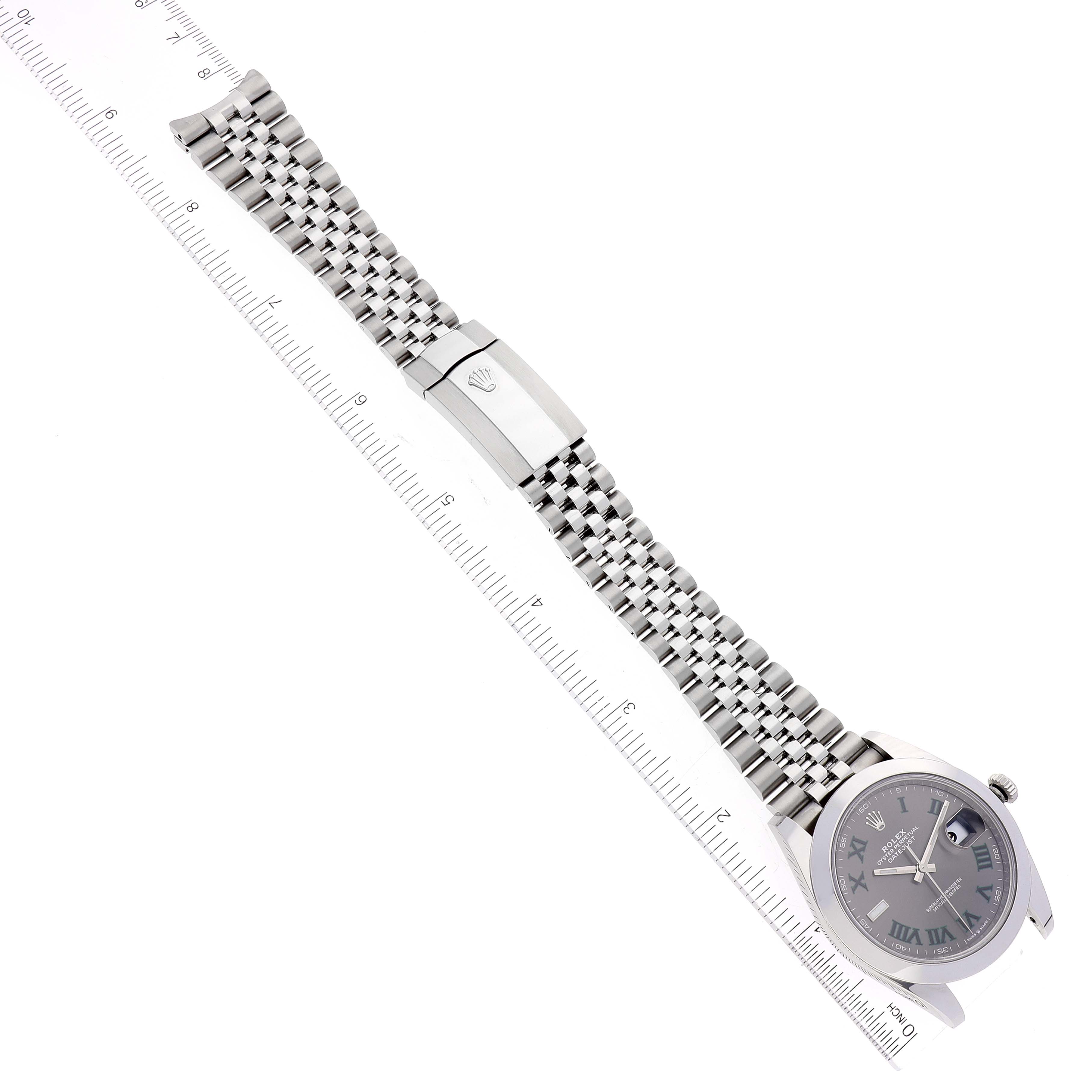 The image shows a Rolex Datejust 41 126300 Men
s Stainless Steel Grey Dial 126300 Men
s Stainless Steel Grey Dial watch laid flat next to a ruler, displaying the face, bracelet, and clasp.