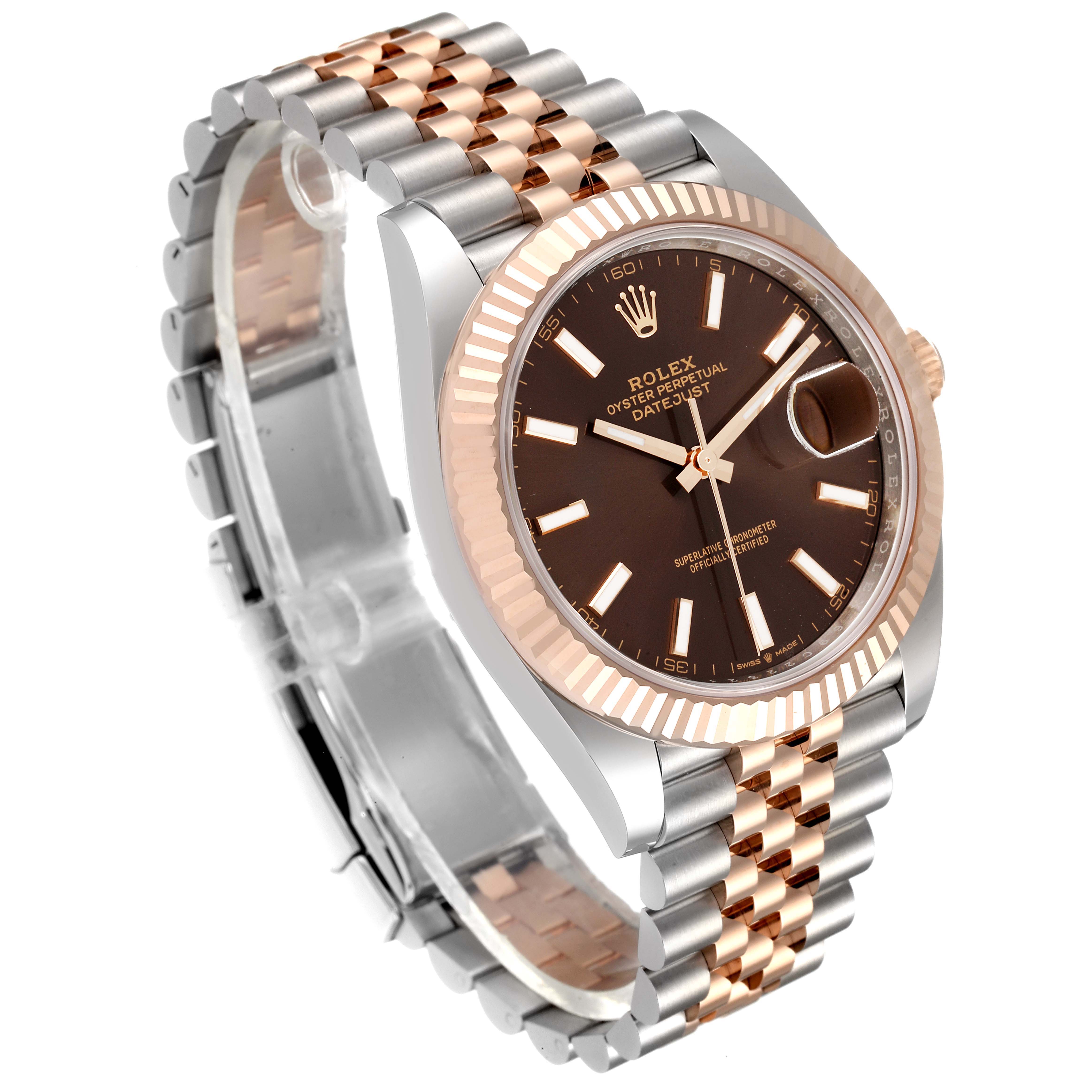 The image shows a Rolex Datejust 41 126331 Men's Steel and Gold (two tone) Brown Dial 126331 Men's Steel and Gold (two tone) Brown Dial, angled to display its dial, fluted bezel, and two-tone bracelet.