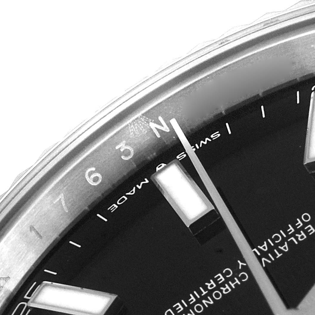 This close-up image of a Rolex Datejust 41 126334 Men
s Stainless Steel Black Dial 126334 Men
s Stainless Steel Black Dial model shows the hour markers, minute markers, and part of the watch
s dial and bezel.