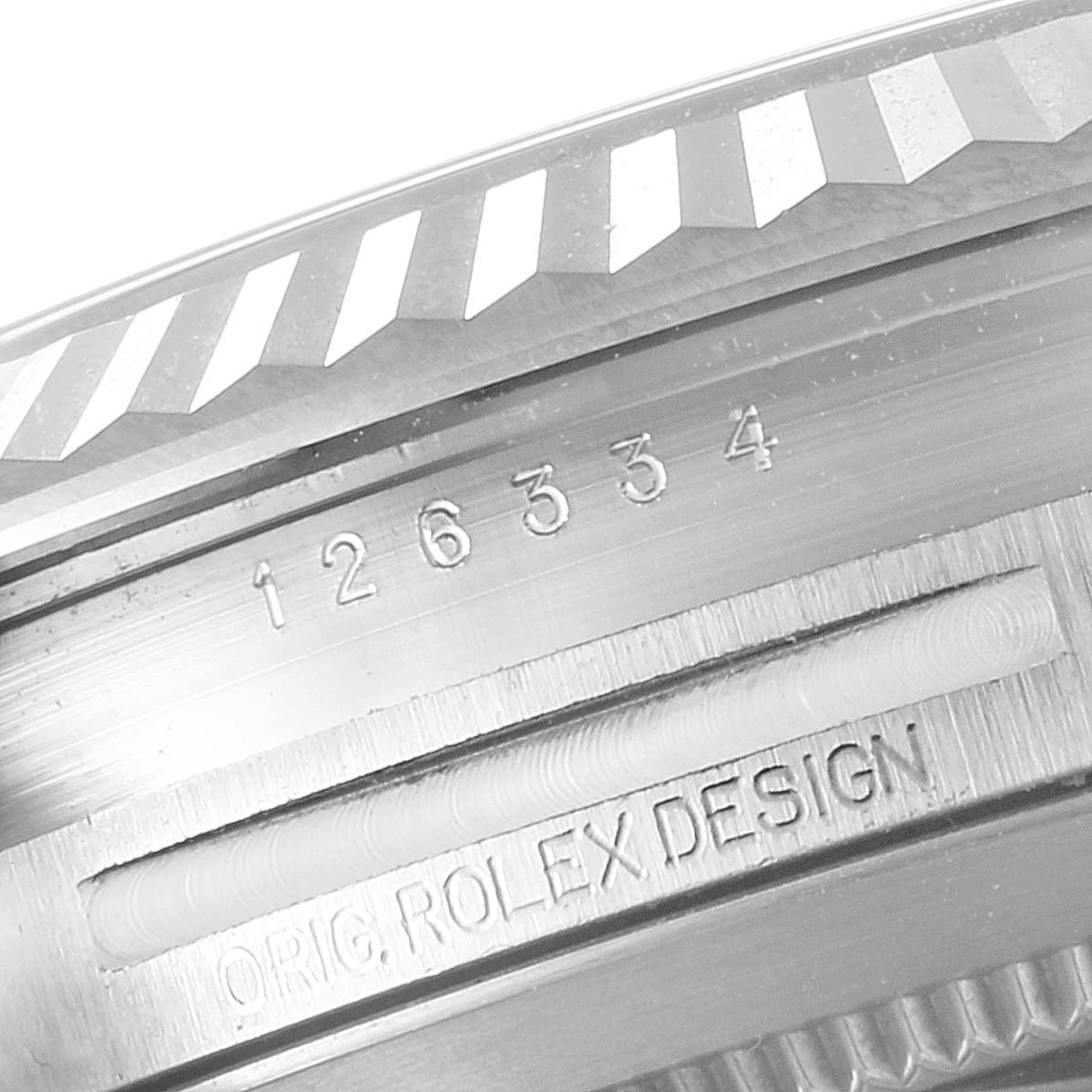 This image shows a close-up of the engraved case back and bezel edge of a Rolex Datejust 41 126334 Men
s Stainless Steel Black Dial 126334 Men
s Stainless Steel Black Dial.