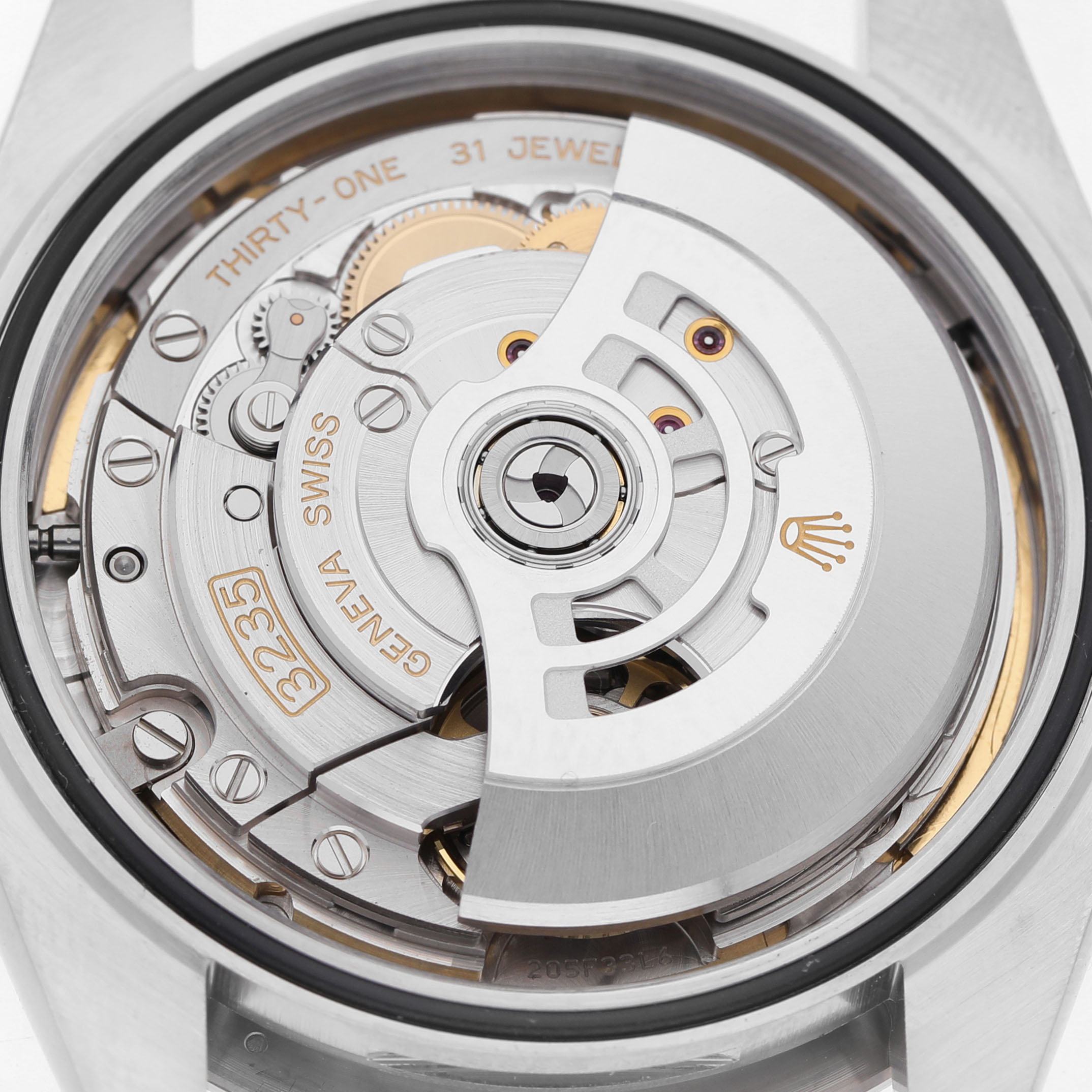 The image shows the movement and rotor from the back of a Rolex Datejust 41 126334 Men's Stainless Steel Blue Dial, displaying the model's intricate mechanics.