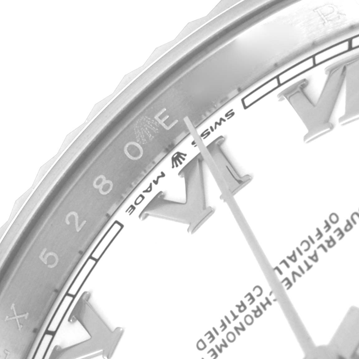 This close-up image of the Rolex Datejust 41 126334 Men
s Stainless Steel White Dial 126334 Men
s Stainless Steel White Dial watch shows a partial view of the dial, bezel, and Roman numeral markers.