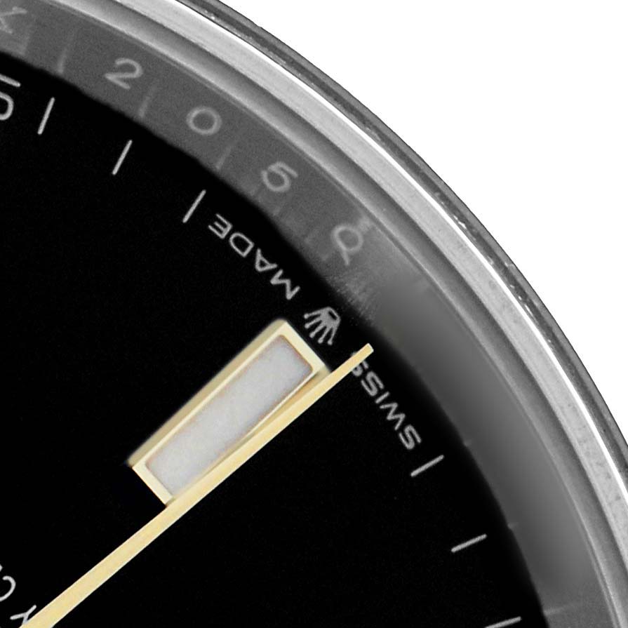 The image shows a close-up of the Rolex Datejust 41 126333 Men's Steel and Gold (two tone) Black Dial's dial edge, featuring part of the minute hand, indices, and the "Swiss Made" marking.