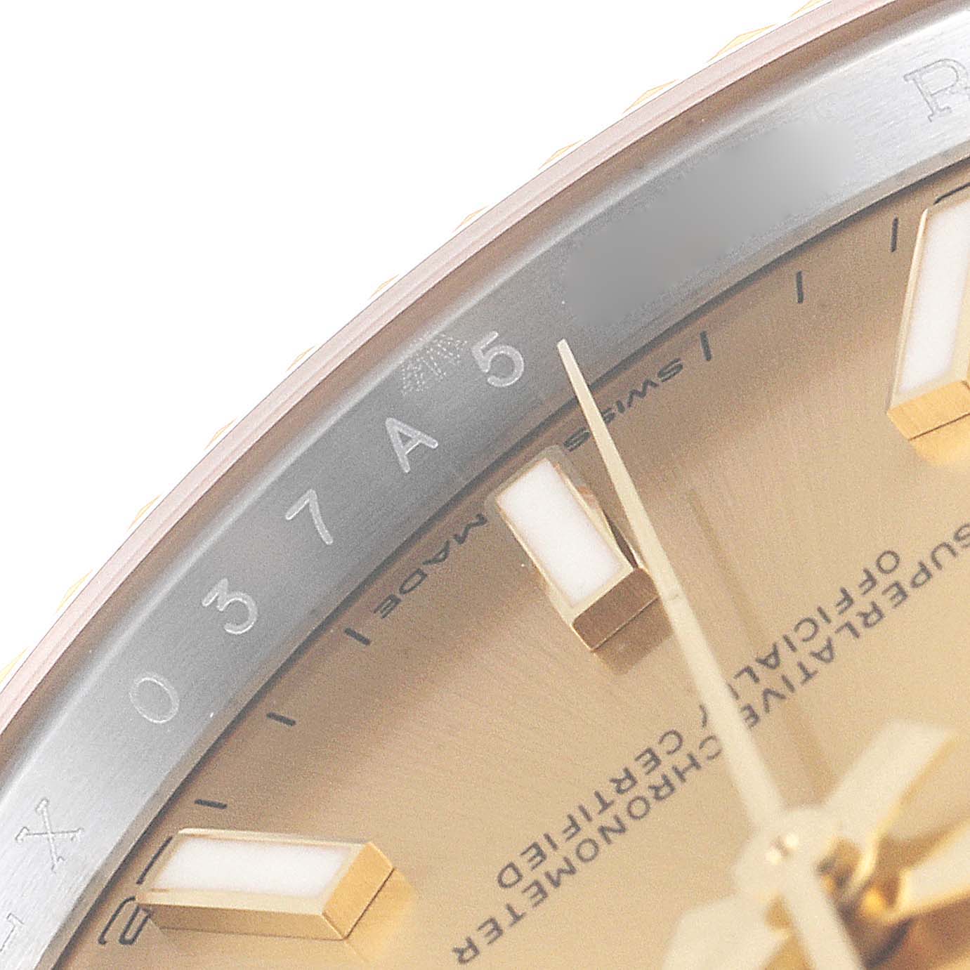 This close-up angle of the Rolex Datejust 41 126333 Men's Steel and Gold (two tone) Champagne Dial 126333 Men's Steel and Gold (two tone) Champagne Dial shows parts of the dial, markers, and the hour hand.