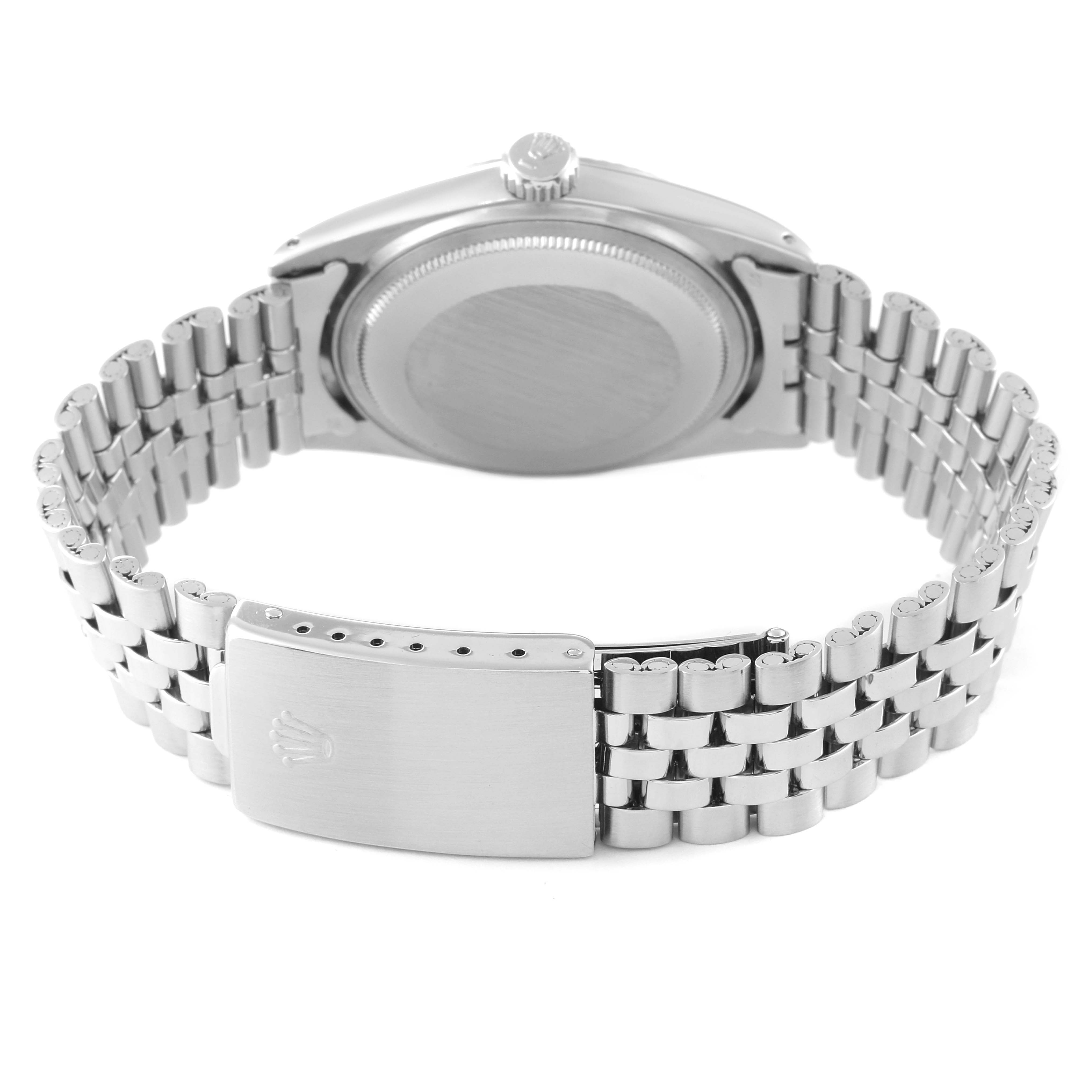 The image shows the back view of a Rolex Vintage Collection 1601 Men
s Stainless Steel Silver Dial 1601 Men
s Stainless Steel Silver Dial watch, highlighting its case back and metal bracelet with a clasp.