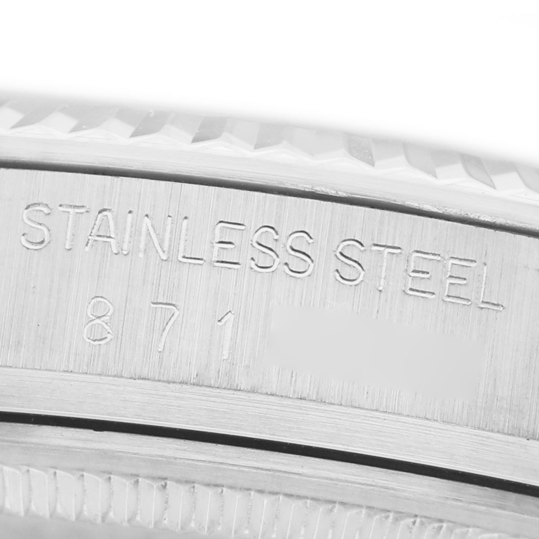 The image shows the side of a Rolex Datejust 16014 Men's Stainless Steel Silver Dial watch with stainless steel engraving, highlighting its material.