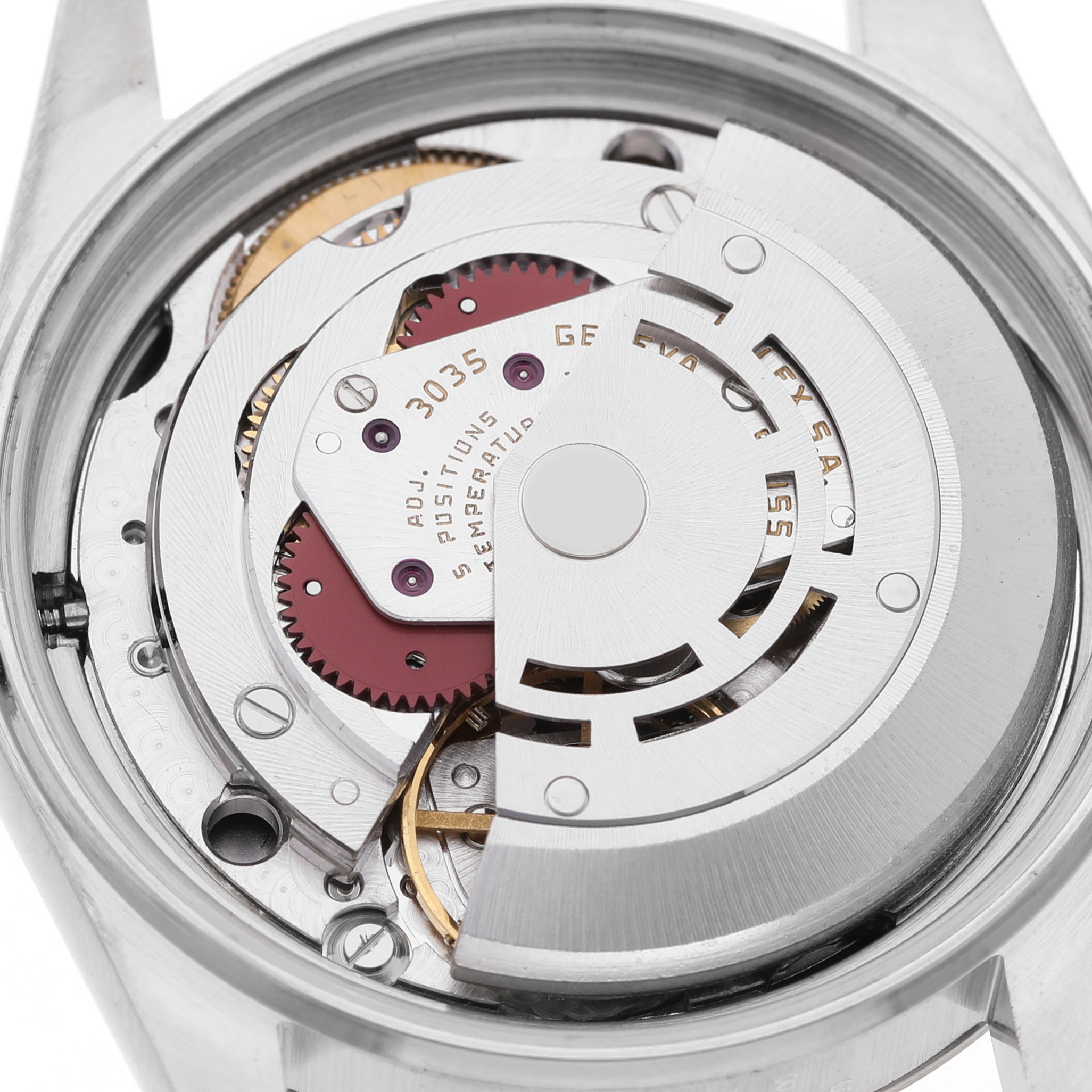 The image shows the movement mechanism of a Rolex Datejust 16014 Men's Stainless Steel Silver Dial, viewed from the back with parts like gears and the rotor visible.
