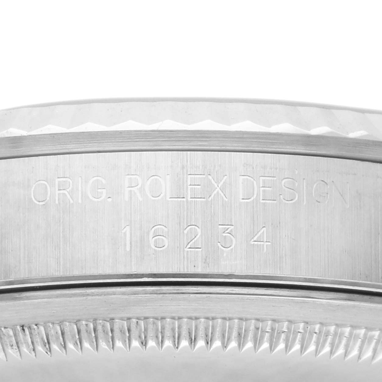 The image shows the side profile of a Rolex Datejust 16234 Men
s Stainless Steel Silver Dial 16234 Men
s Stainless Steel Silver Dial watch
s case, highlighting the engraved model number and fluted bezel.