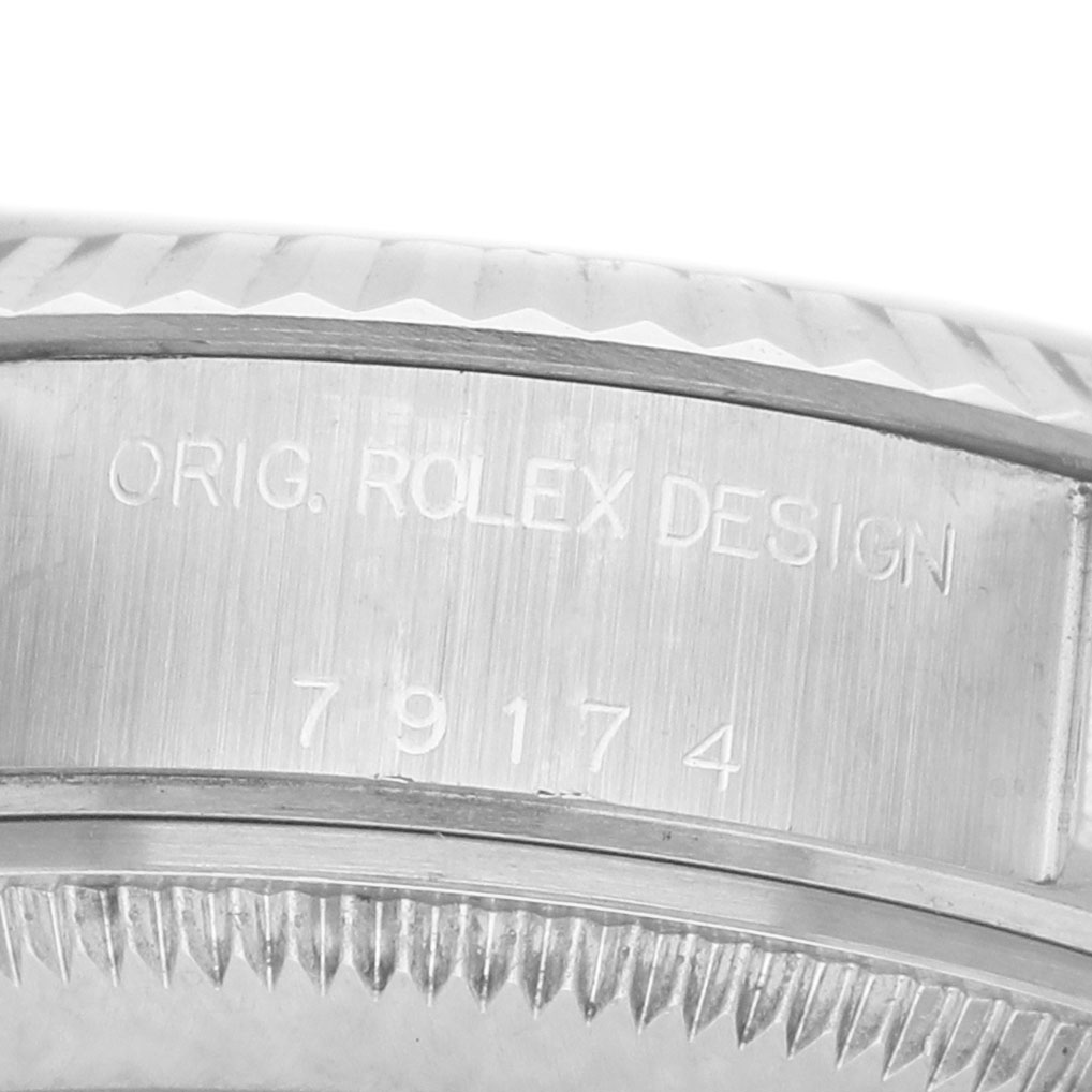 The image shows a close-up of the side engraving on the case of a Rolex Datejust 79174 Women's Stainless Steel Silver Dial watch, highlighting the model number.