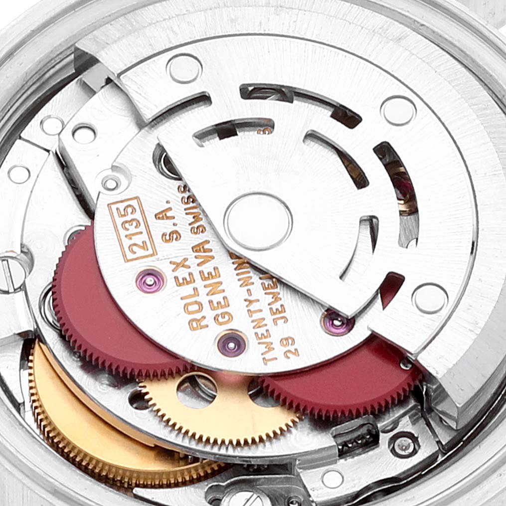 The image shows a close-up view of the movement mechanism inside a Rolex Datejust 69173 Women's Steel and Gold (two tone) Silver Dial 69173 Women's Steel and Gold (two tone) Silver Dial watch, highlighting gears and other intricate components.