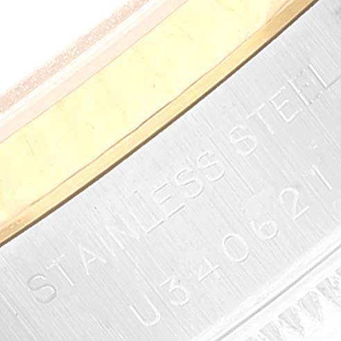 Close-up of a Rolex Datejust 69173 Women's Steel and Gold (two tone) Silver Dial 69173 Women's Steel and Gold (two tone) Silver Dial watch showing part of the bezel and engraved text on the case.