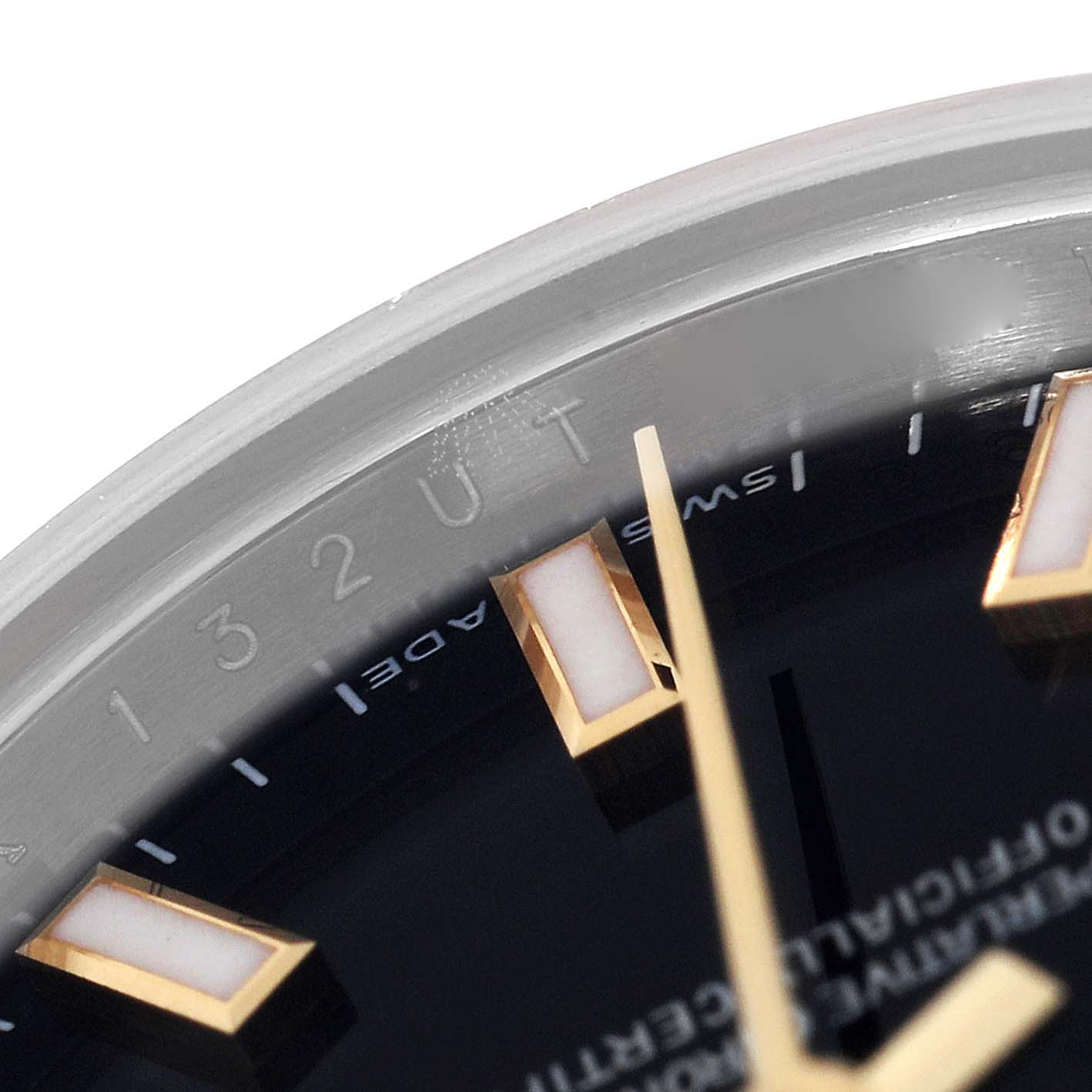 This image is a close-up of the edge of the dial and bezel of a Rolex Datejust 179173 Women's Steel and Gold (two tone) Black Dial 179173 Women's Steel and Gold (two tone) Black Dial watch, showing hour markers and partial serial engraving.