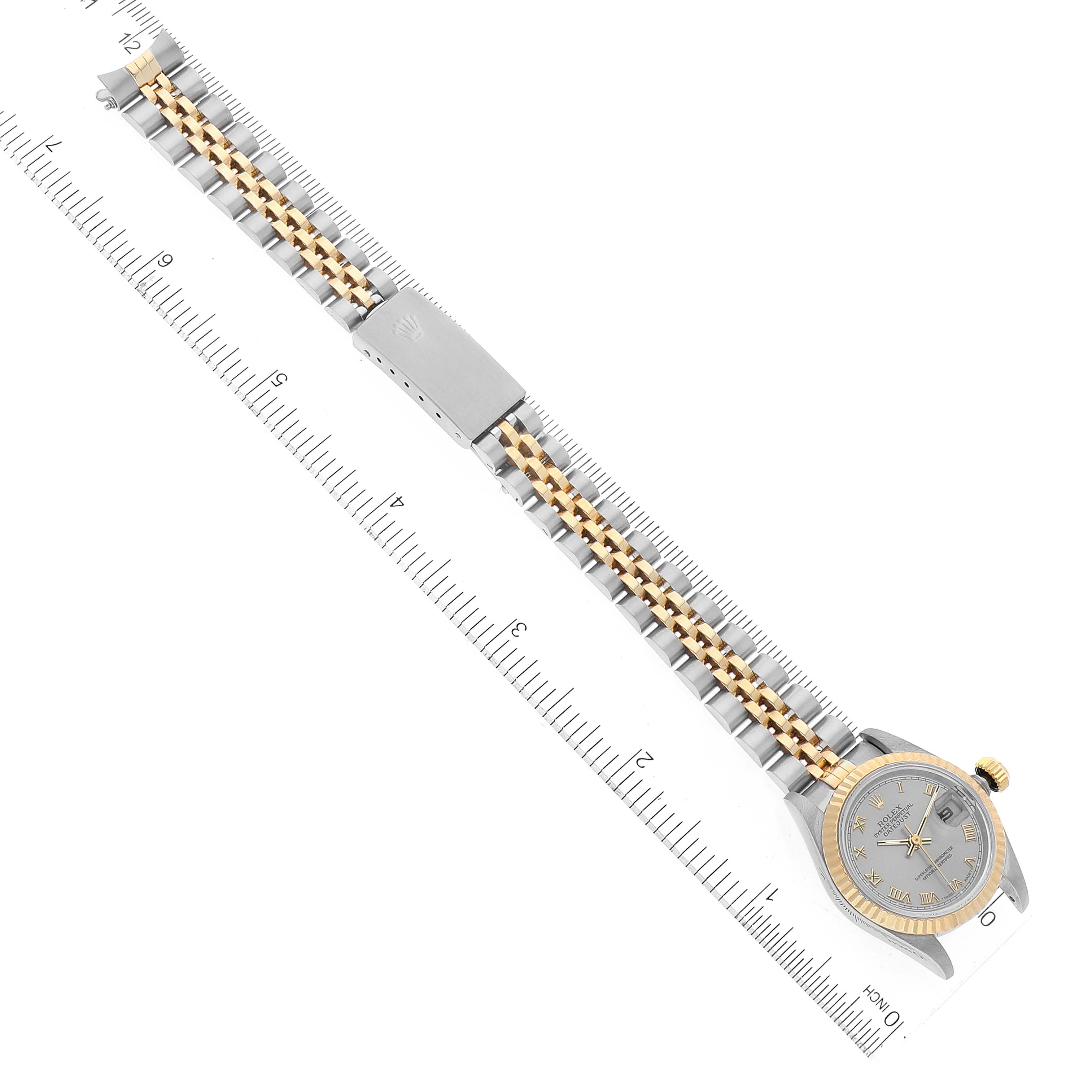 The image shows a Rolex Datejust 69173 Women's Steel and Gold (two tone) Grey Dial 69173 Women's Steel and Gold (two tone) Grey Dial watch laid flat alongside a ruler, highlighting its bracelet and face.