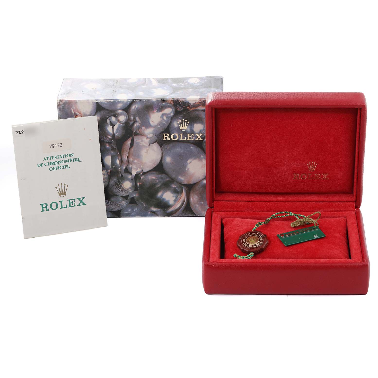 This image shows the packaging, certification, and tags for a Rolex Datejust 79173 Women's Steel and Gold (two tone) Champagne Dial 79173 Women's Steel and Gold (two tone) Champagne Dial watch.