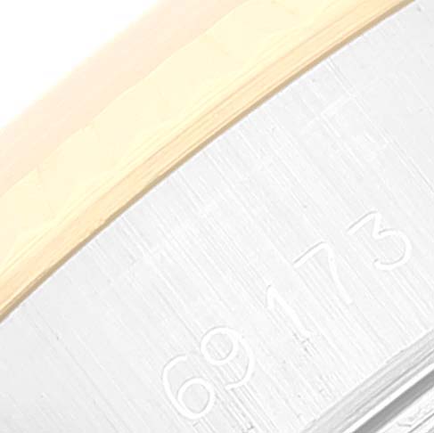 The image shows a close-up of the case side of the Rolex Datejust 69173 Women's Steel and Gold (two tone) Champagne Dial 69173 Women's Steel and Gold (two tone) Champagne Dial watch with the model number 69173 engraved.
