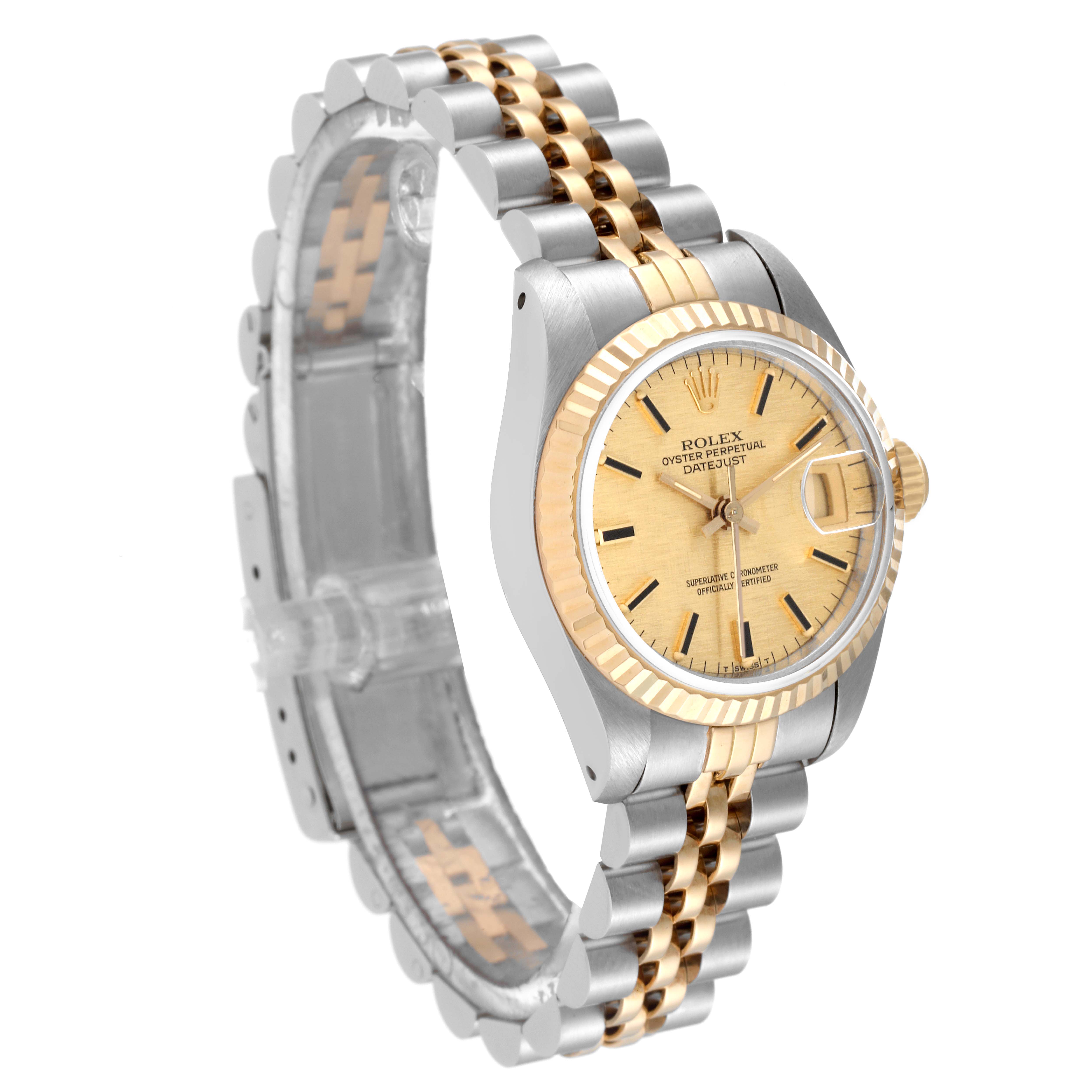 This Rolex Datejust 69173 Women's Steel and Gold (two tone) Champagne Dial 69173 Women's Steel and Gold (two tone) Champagne Dial watch is shown at a three-quarter angle, displaying its dial, bezel, case, and two-tone bracelet.