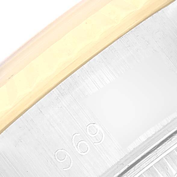 The image shows a close-up of the serial number engraving on the bezel of a Rolex Datejust 69173 Women's Steel and Gold (two tone) Champagne Dial 69173 Women's Steel and Gold (two tone) Champagne Dial watch.