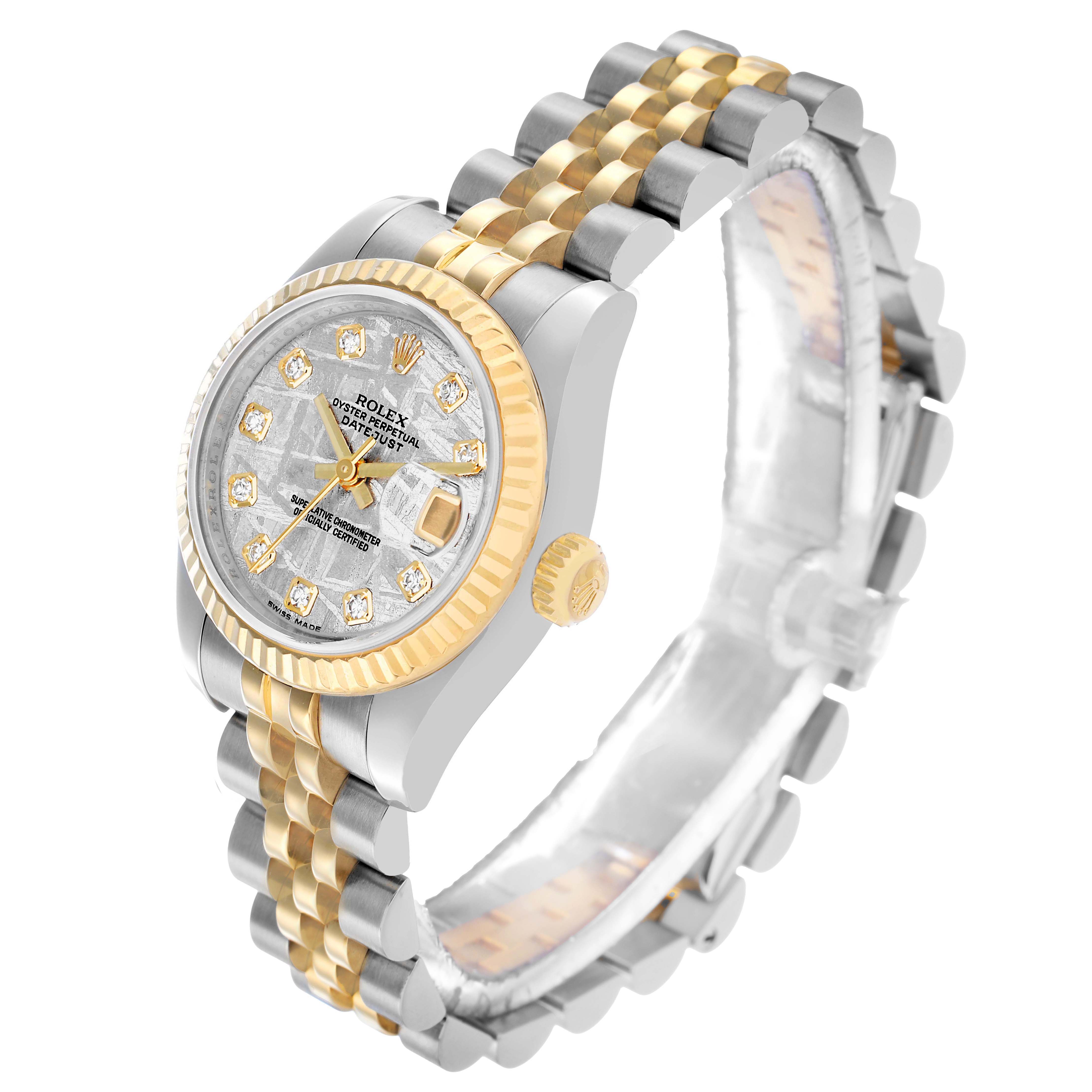 The Rolex Datejust 179173 Women's Steel and Gold (two tone) Silver Dial watch is shown at an angled side view, highlighting the dial, crown, two-tone bezel, and bracelet.
