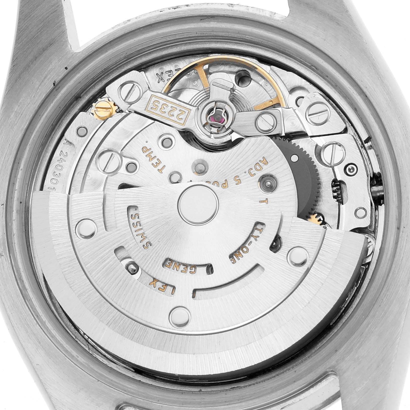 The image shows a close-up of the movement inside a Rolex Datejust 179173 Women's Steel and Gold (two tone) Silver Dial, highlighting its intricate mechanical components.