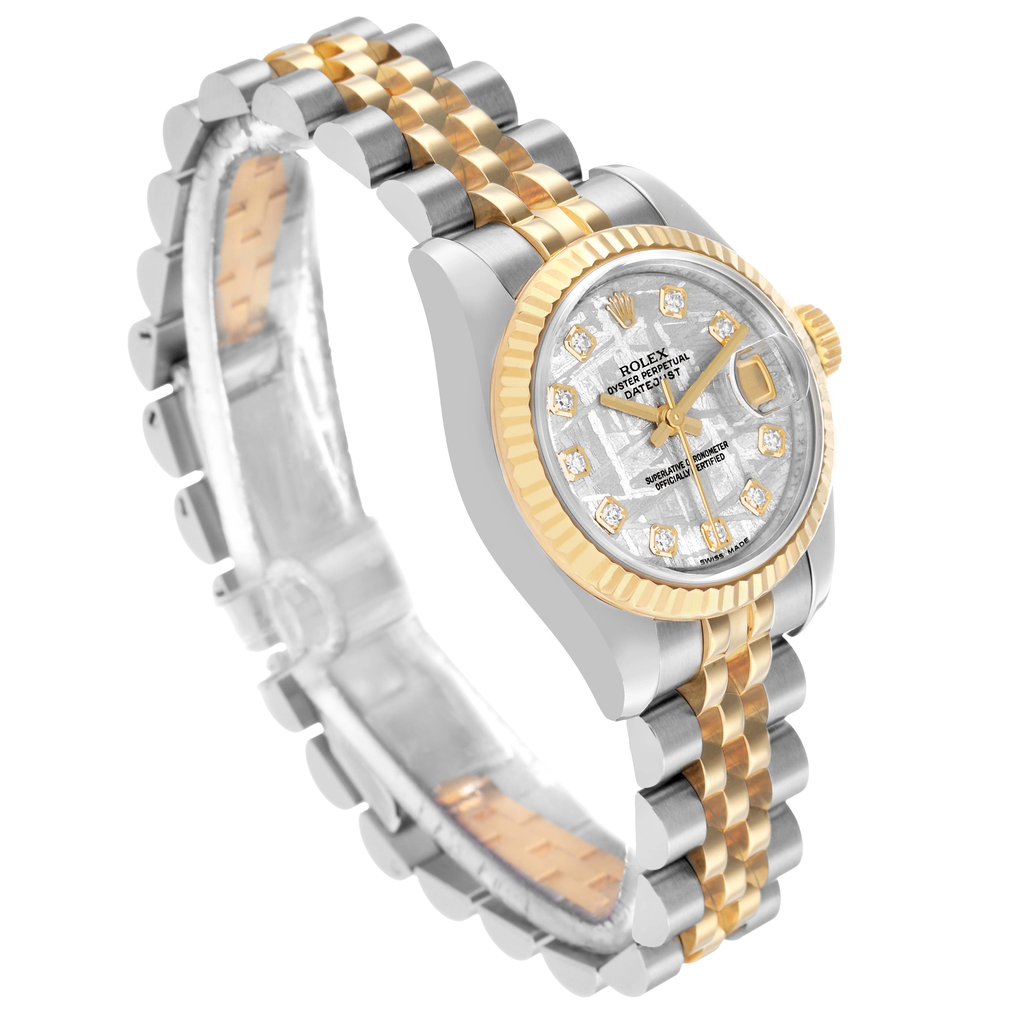 The Rolex Datejust 179173 Women's Steel and Gold (two tone) Silver Dial watch is shown at a three-quarter angle, highlighting its face, bezel, bracelet, and crown.