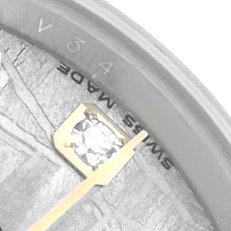 The image shows a close-up of the Rolex Datejust 179173 Women's Steel and Gold (two tone) Silver Dial's dial edge, including a diamond marker and part of the "Swiss Made" inscription.