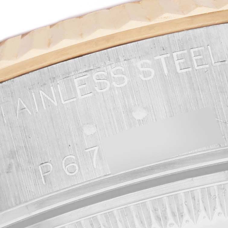 The image shows a close-up of the engraved stainless steel case back edge of a Rolex Datejust 79173 Women's Steel and Gold (two tone) White Dial 79173 Women's Steel and Gold (two tone) White Dial watch.