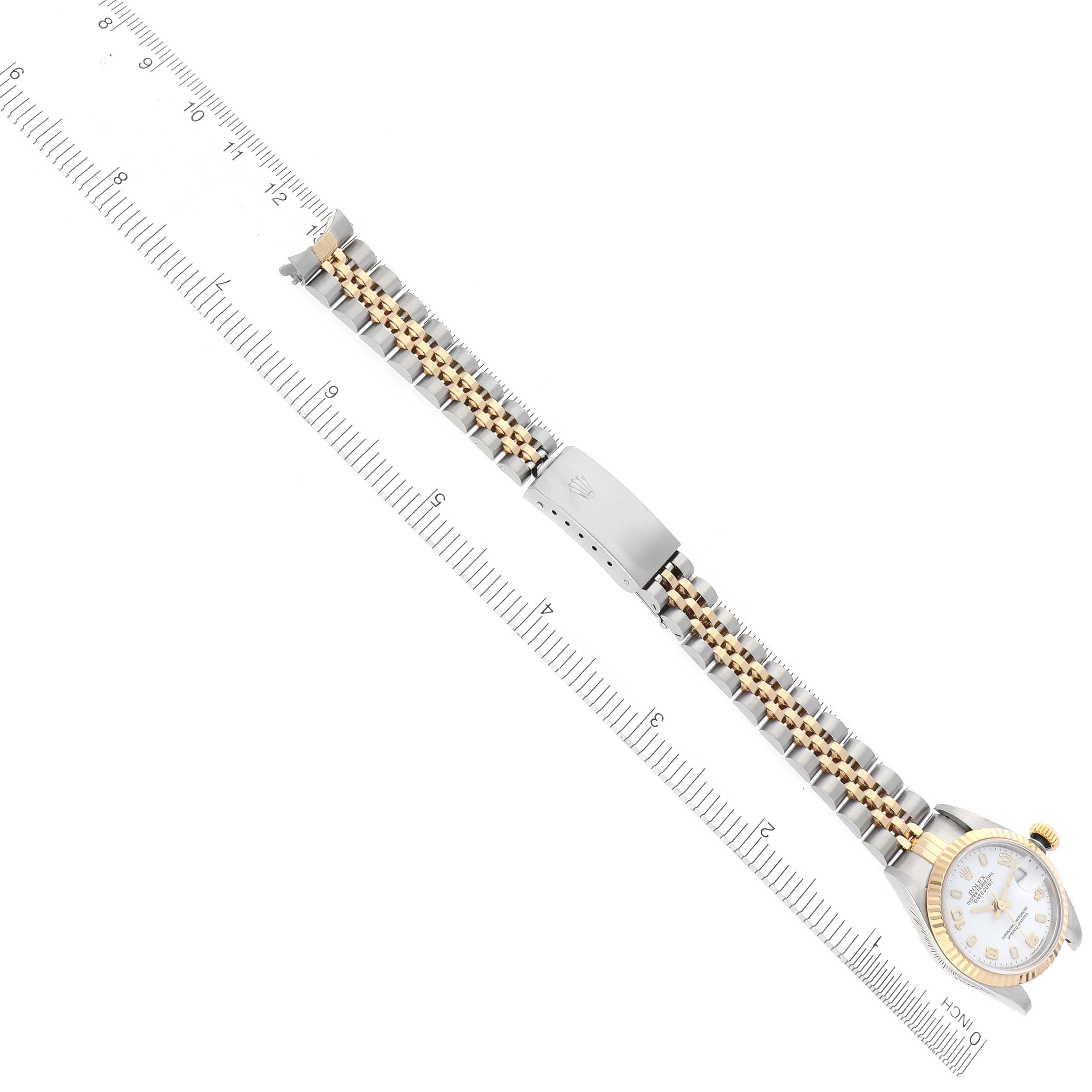The Rolex Datejust 79173 Women's Steel and Gold (two tone) White Dial 79173 Women's Steel and Gold (two tone) White Dial watch is shown from a top-down angle, displaying the full bracelet, case, and clasp.