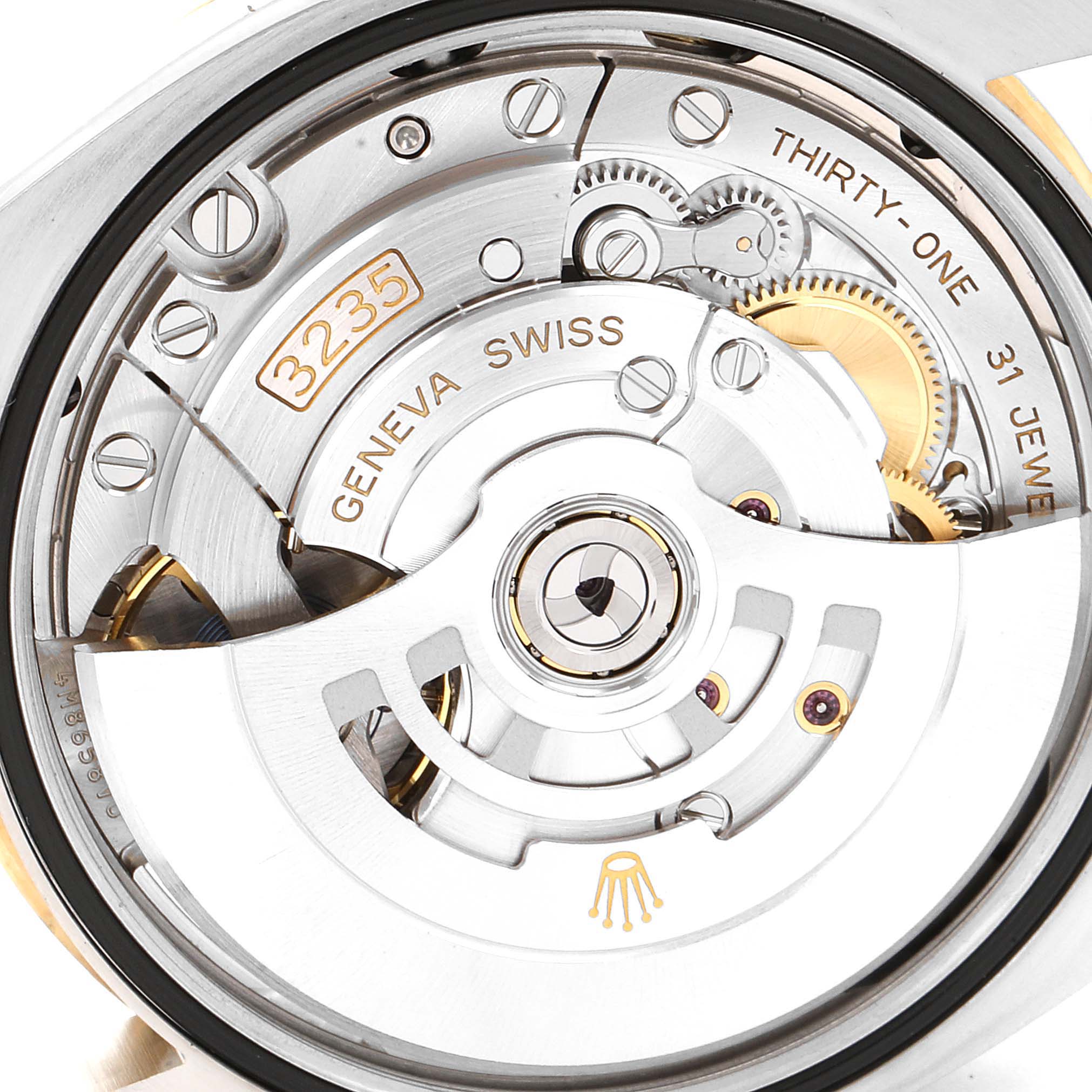 This image shows a close-up view of the movement and internal mechanism of a Rolex Datejust 126233 Men's Steel and Gold (two tone) White Dial 126233 Men's Steel and Gold (two tone) White Dial watch.