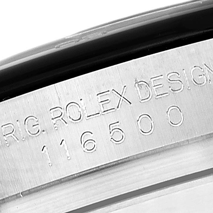 The image shows a close-up view of the engraved serial number and "ROLEX DESIGN" on the casing of a Rolex Daytona 116500 Men's Stainless Steel Black Dial 116500 Men's Stainless Steel Black Dial watch.