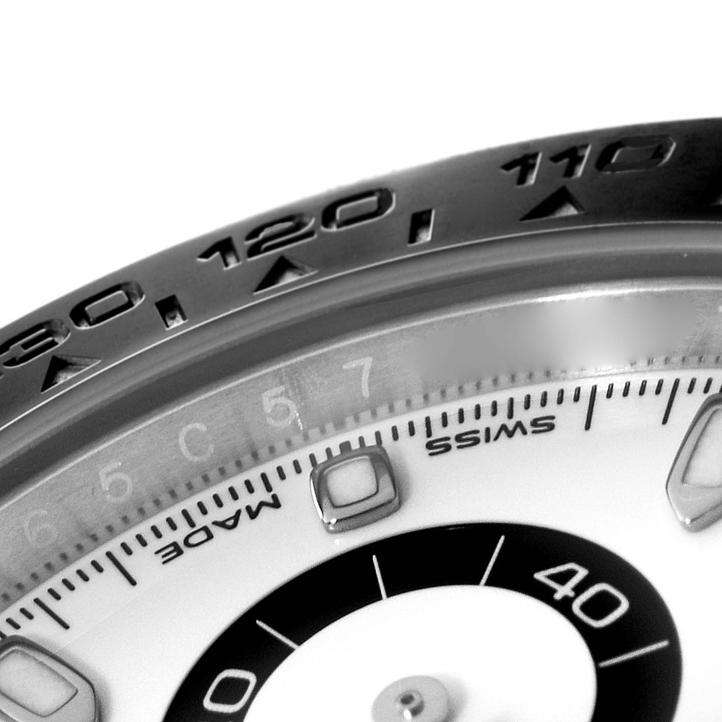 This close-up shows the bezel and part of the dial of the Rolex Daytona 116500 Men's Stainless Steel White Dial 116500 Men's Stainless Steel White Dial watch.
