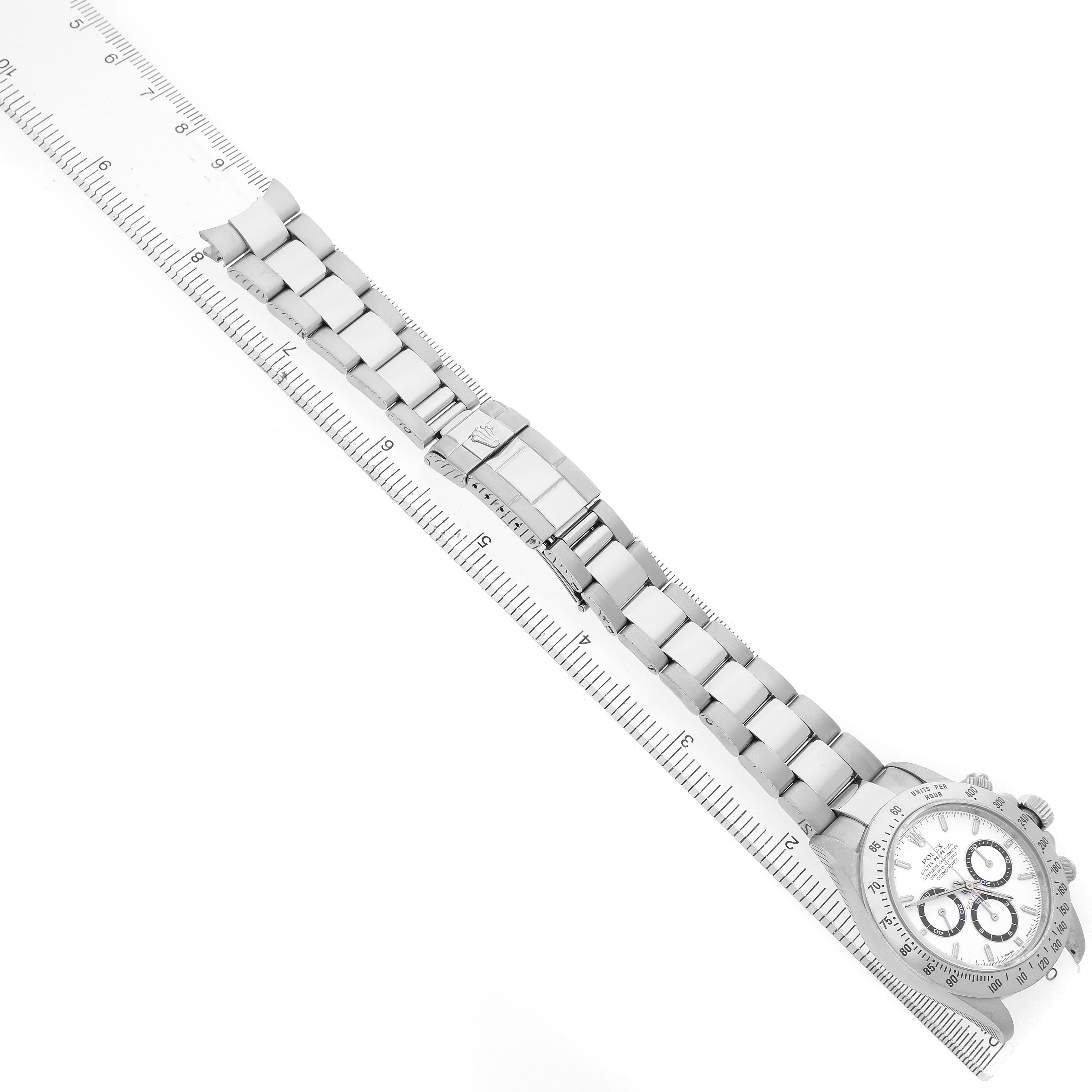 The Rolex Daytona 16520 Men's Stainless Steel White Dial watch is shown from an overhead angle, highlighting its bracelet, clasp, and part of the dial and crown.