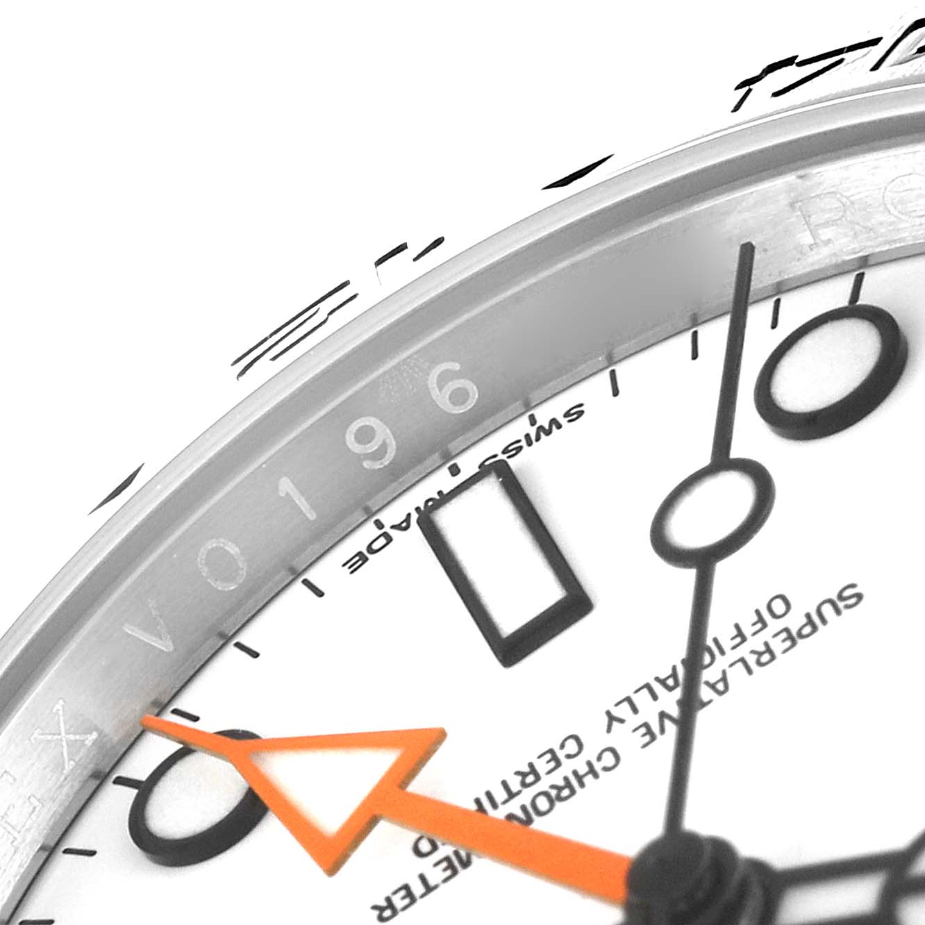 This close-up of the Rolex Explorer 216570 Men's Stainless Steel White Dial 216570 Men's Stainless Steel White Dial watch shows part of the dial, hands, and inscription on the bezel.