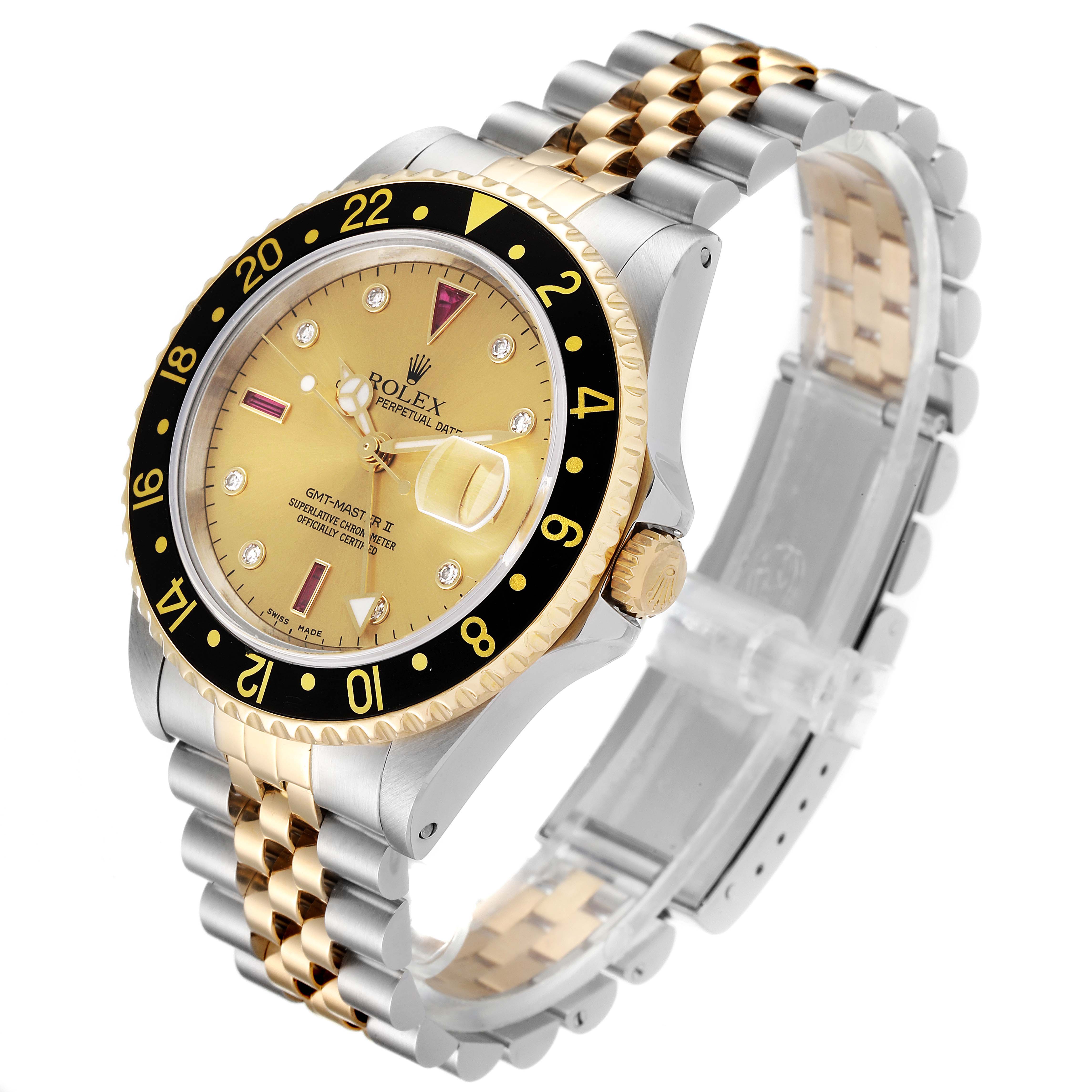 The image shows a side angle of the Rolex GMT-Master 16713 Men's Steel and Gold (two tone) Champagne Dial 16713 Men's Steel and Gold (two tone) Champagne Dial watch, highlighting the bezel, dial, and two-tone metal bracelet.