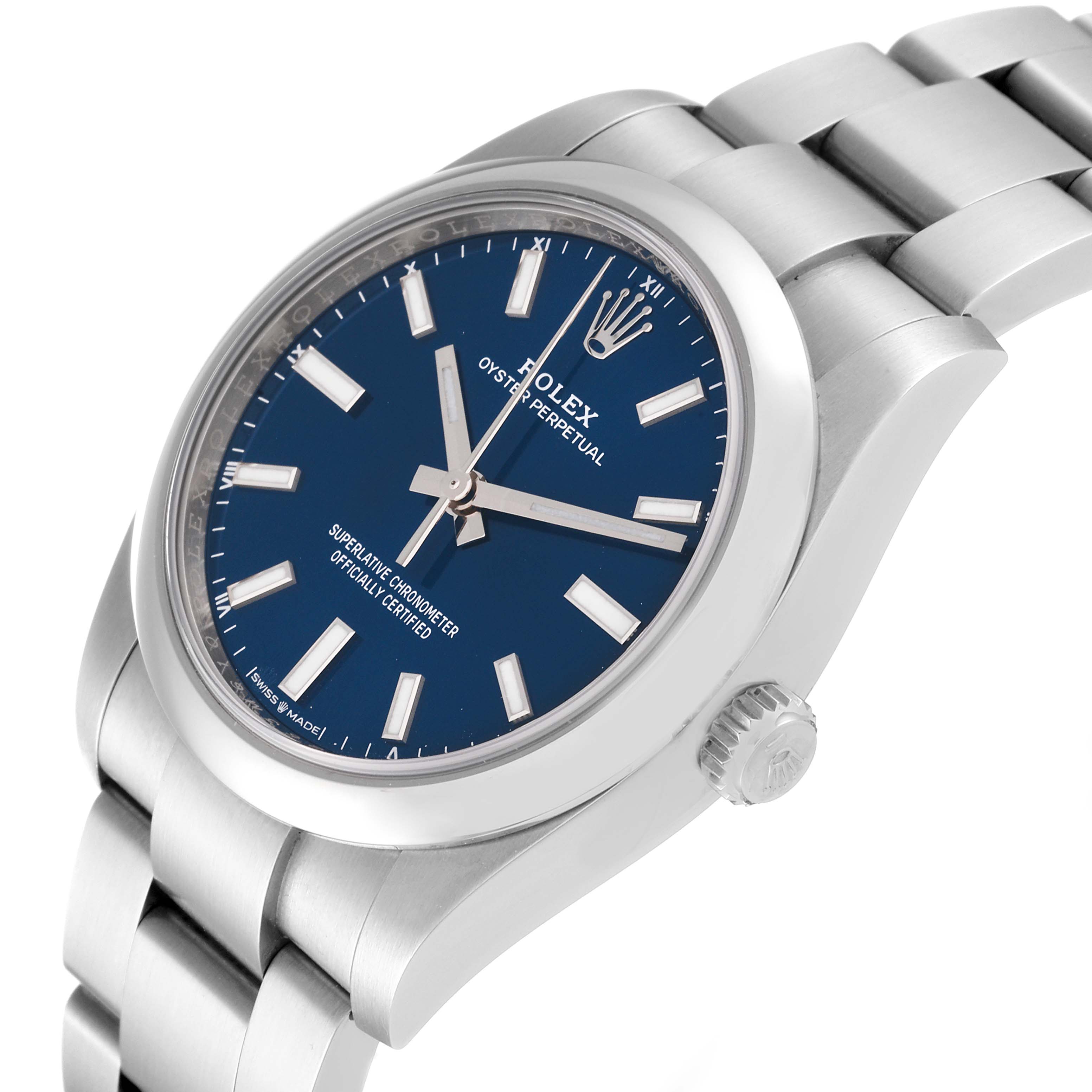 The image shows a side angle view of a Rolex Oyster Perpetual 124200 Men's Stainless Steel Blue Dial 124200 Men's Stainless Steel Blue Dial watch, highlighting the blue dial, crown, and bracelet.